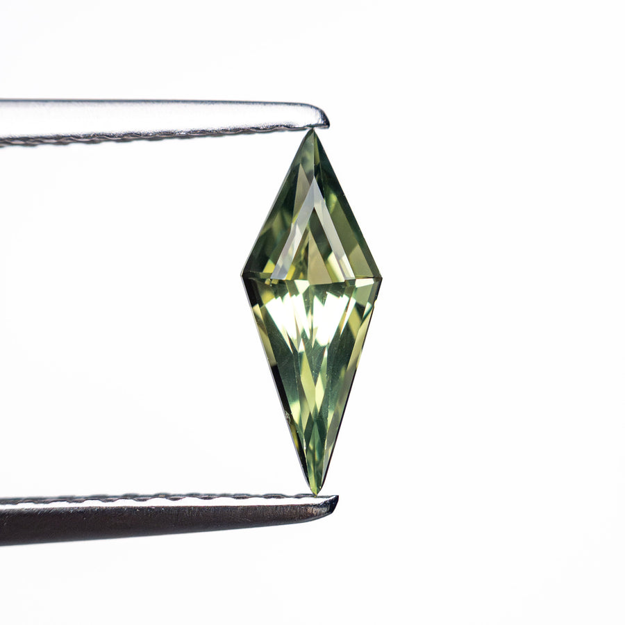 The 0.51ct 9.76x3.78x2.66mm Kite Step Cut Sapphire 25740-22 by East London jeweller Rachel Boston | Discover our collections of unique and timeless engagement rings, wedding rings, and modern fine jewellery. - Rachel Boston Jewellery