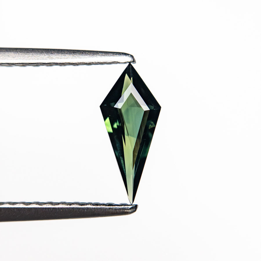 The 0.38ct 8.91x3.90x1.99mm Kite Step Cut Sapphire 25740-28 by East London jeweller Rachel Boston | Discover our collections of unique and timeless engagement rings, wedding rings, and modern fine jewellery. - Rachel Boston Jewellery