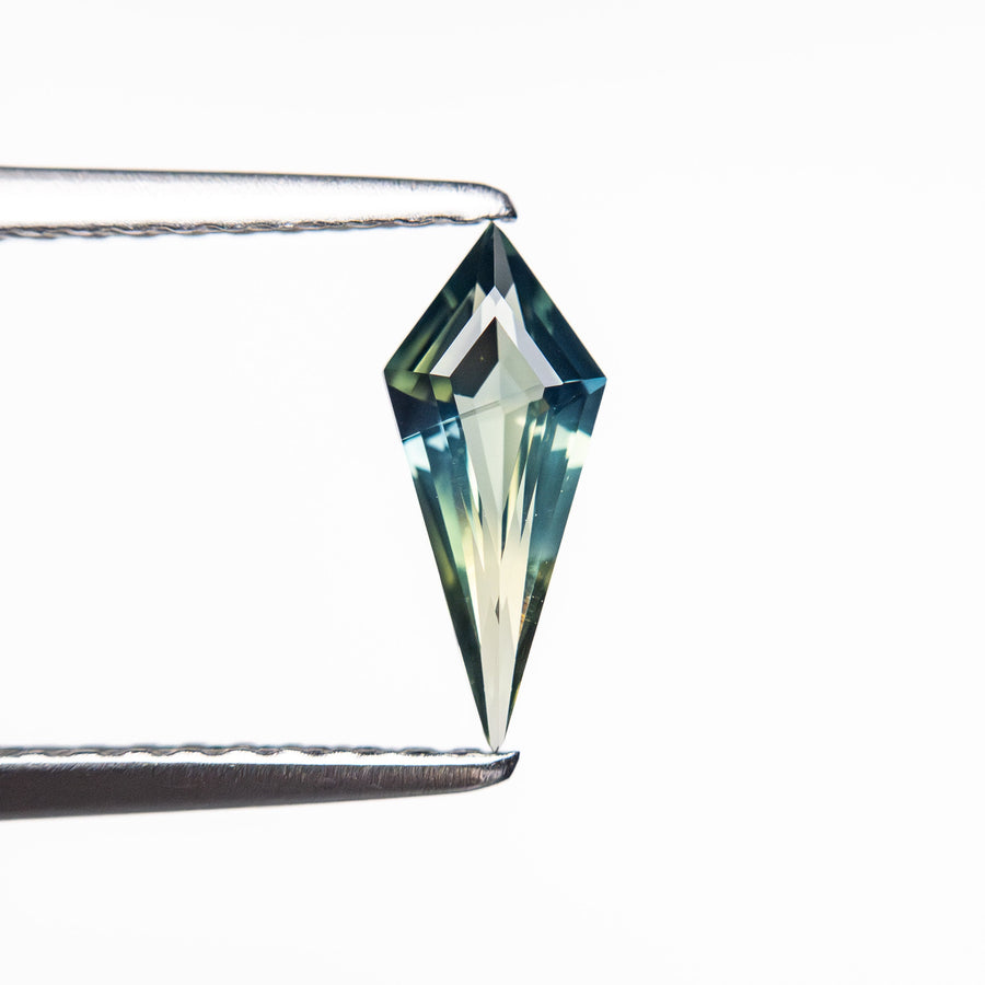 The 0.39ct 9.03x3.81x2.10mm Kite Step Cut Sapphire 25740-29 by East London jeweller Rachel Boston | Discover our collections of unique and timeless engagement rings, wedding rings, and modern fine jewellery. - Rachel Boston Jewellery