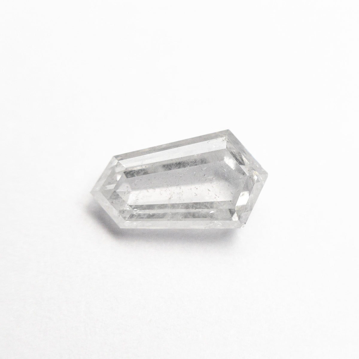 The 1.47ct 9.65x5.40x3.34mm Shield Step Cut 25807-34 by East London jeweller Rachel Boston | Discover our collections of unique and timeless engagement rings, wedding rings, and modern fine jewellery.