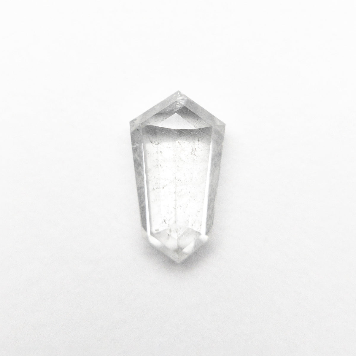 The 1.47ct 9.65x5.40x3.34mm Shield Step Cut 25807-34 by East London jeweller Rachel Boston | Discover our collections of unique and timeless engagement rings, wedding rings, and modern fine jewellery.