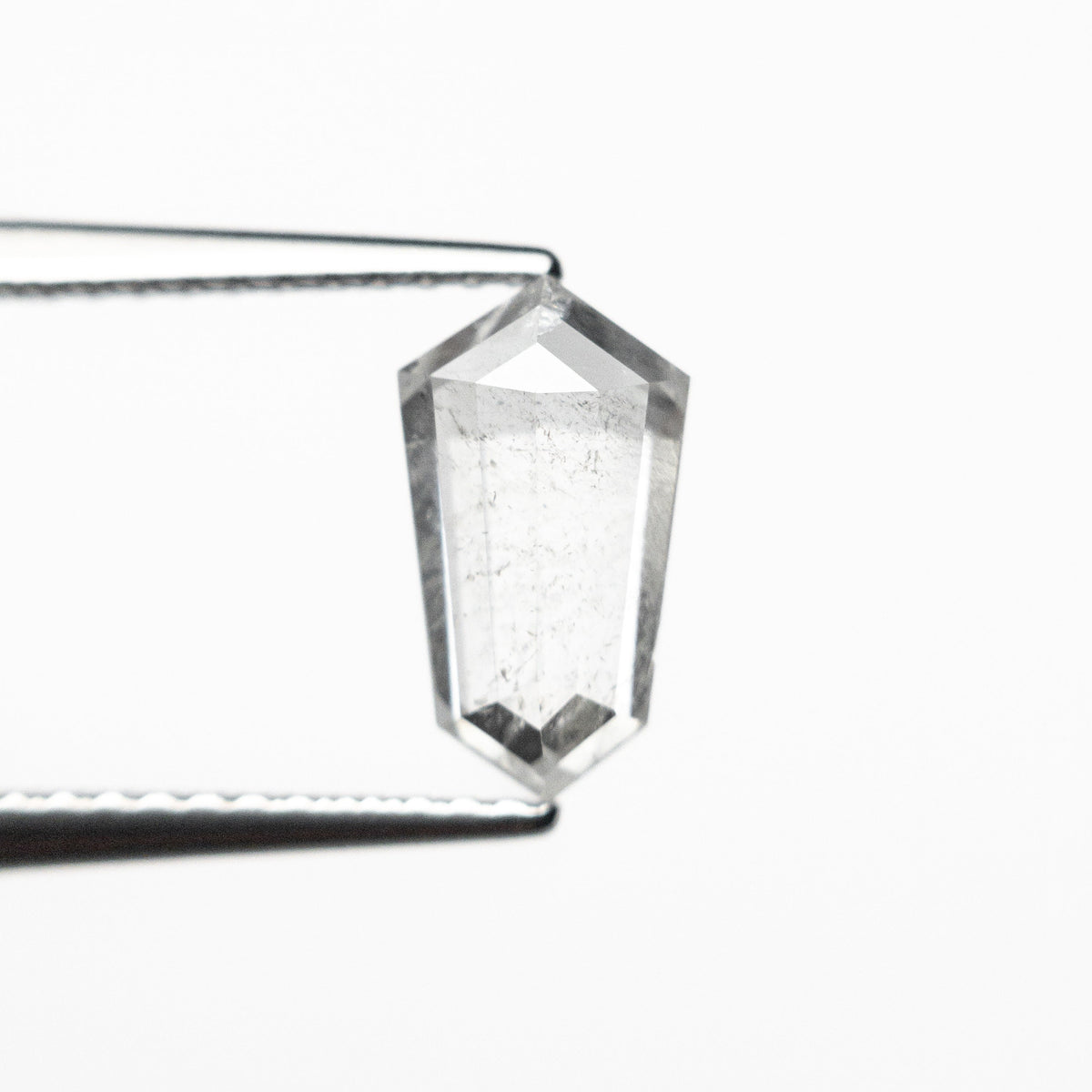 The 1.47ct 9.65x5.40x3.34mm Shield Step Cut 25807-34 by East London jeweller Rachel Boston | Discover our collections of unique and timeless engagement rings, wedding rings, and modern fine jewellery.