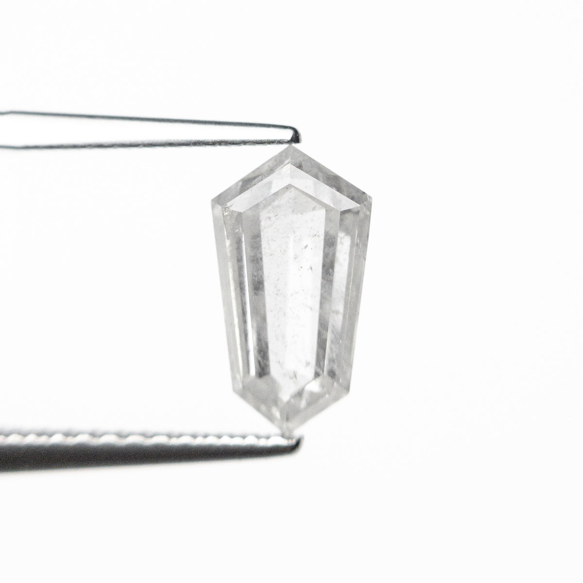 The 1.47ct 9.65x5.40x3.34mm Shield Step Cut 25807-34 by East London jeweller Rachel Boston | Discover our collections of unique and timeless engagement rings, wedding rings, and modern fine jewellery.