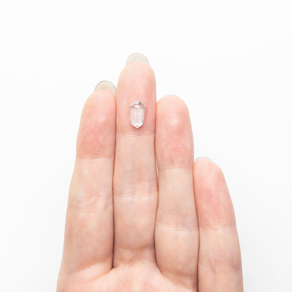 The 1.47ct 9.65x5.40x3.34mm Shield Step Cut 25807-34 by East London jeweller Rachel Boston | Discover our collections of unique and timeless engagement rings, wedding rings, and modern fine jewellery.