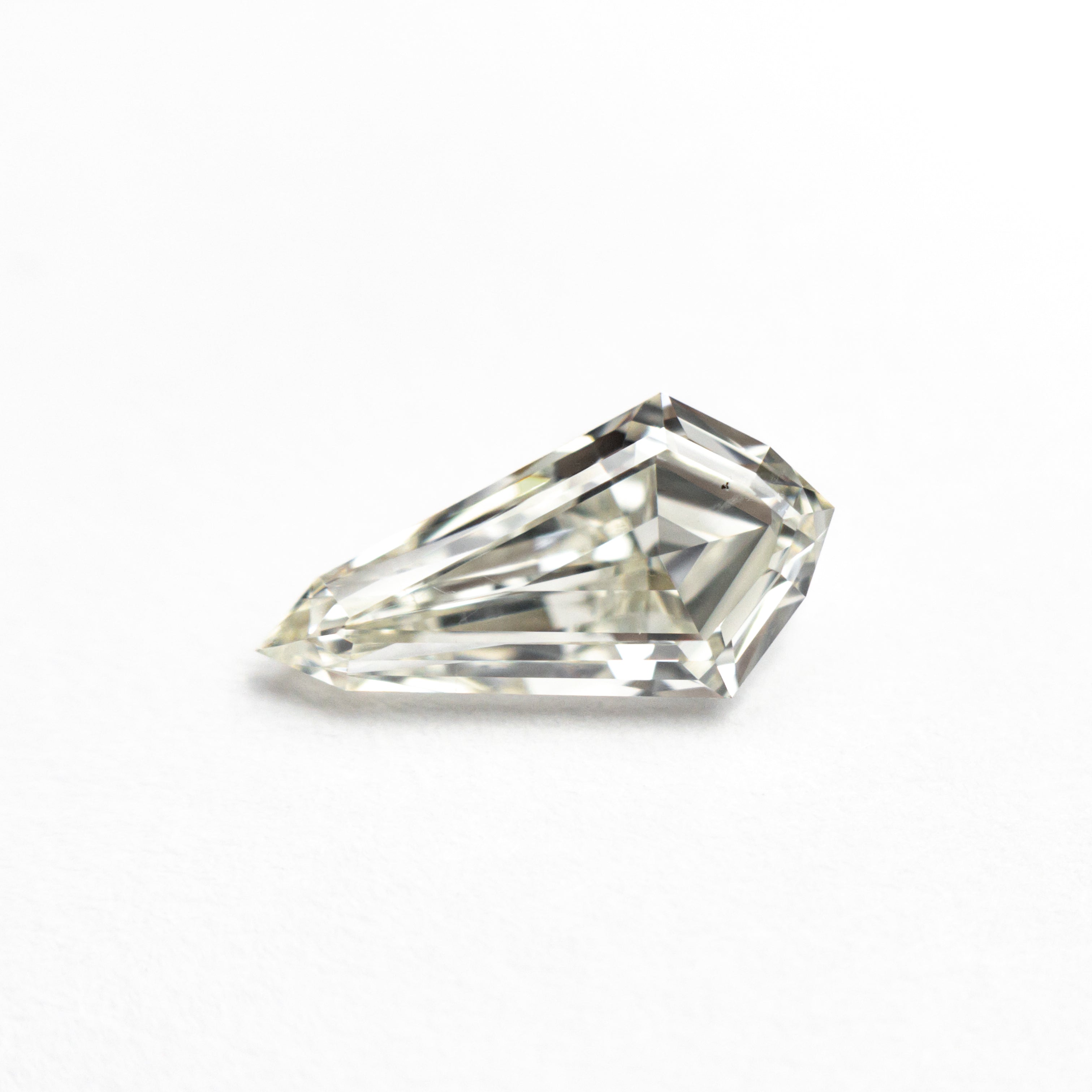 The 0.91ct 9.95x5.23x2.88mm SI1 K Shield Step Cut 25955-01 by East London jeweller Rachel Boston | Discover our collections of unique and timeless engagement rings, wedding rings, and modern fine jewellery.