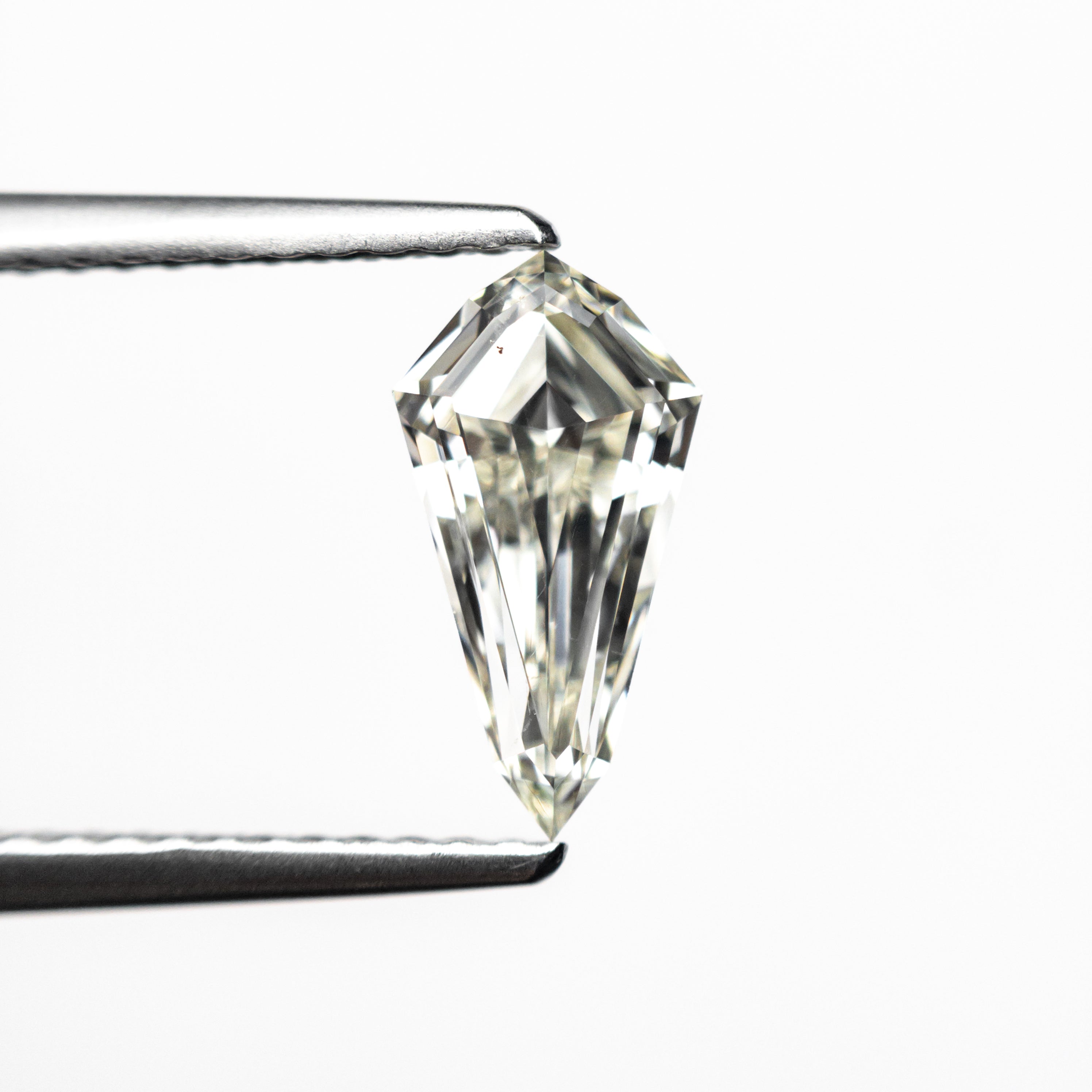 The 0.91ct 9.95x5.23x2.88mm SI1 K Shield Step Cut 25955-01 by East London jeweller Rachel Boston | Discover our collections of unique and timeless engagement rings, wedding rings, and modern fine jewellery.