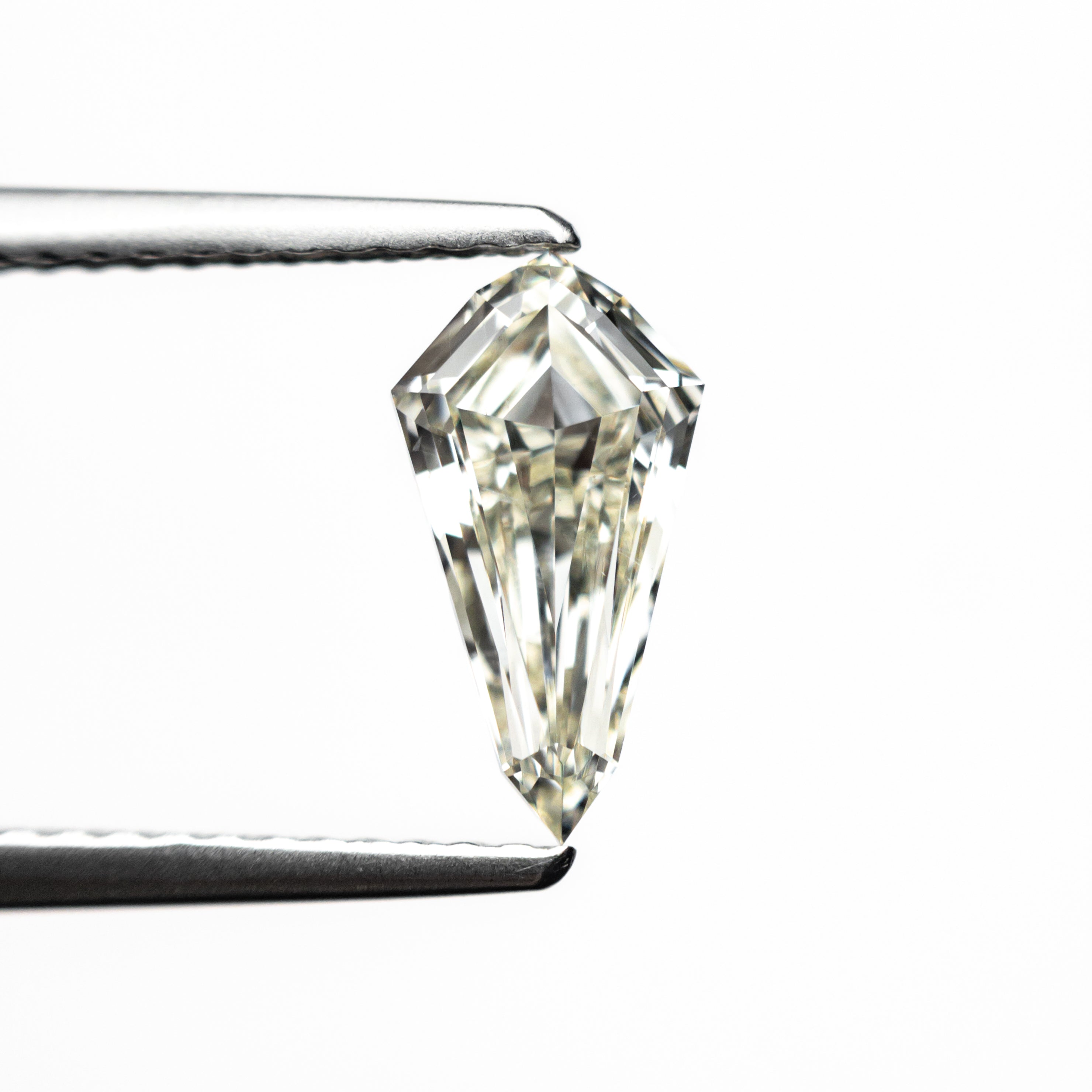 The 0.95ct 9.89x5.22x2.99mm SI1 L Shield Step Cut 25955-02 by East London jeweller Rachel Boston | Discover our collections of unique and timeless engagement rings, wedding rings, and modern fine jewellery.