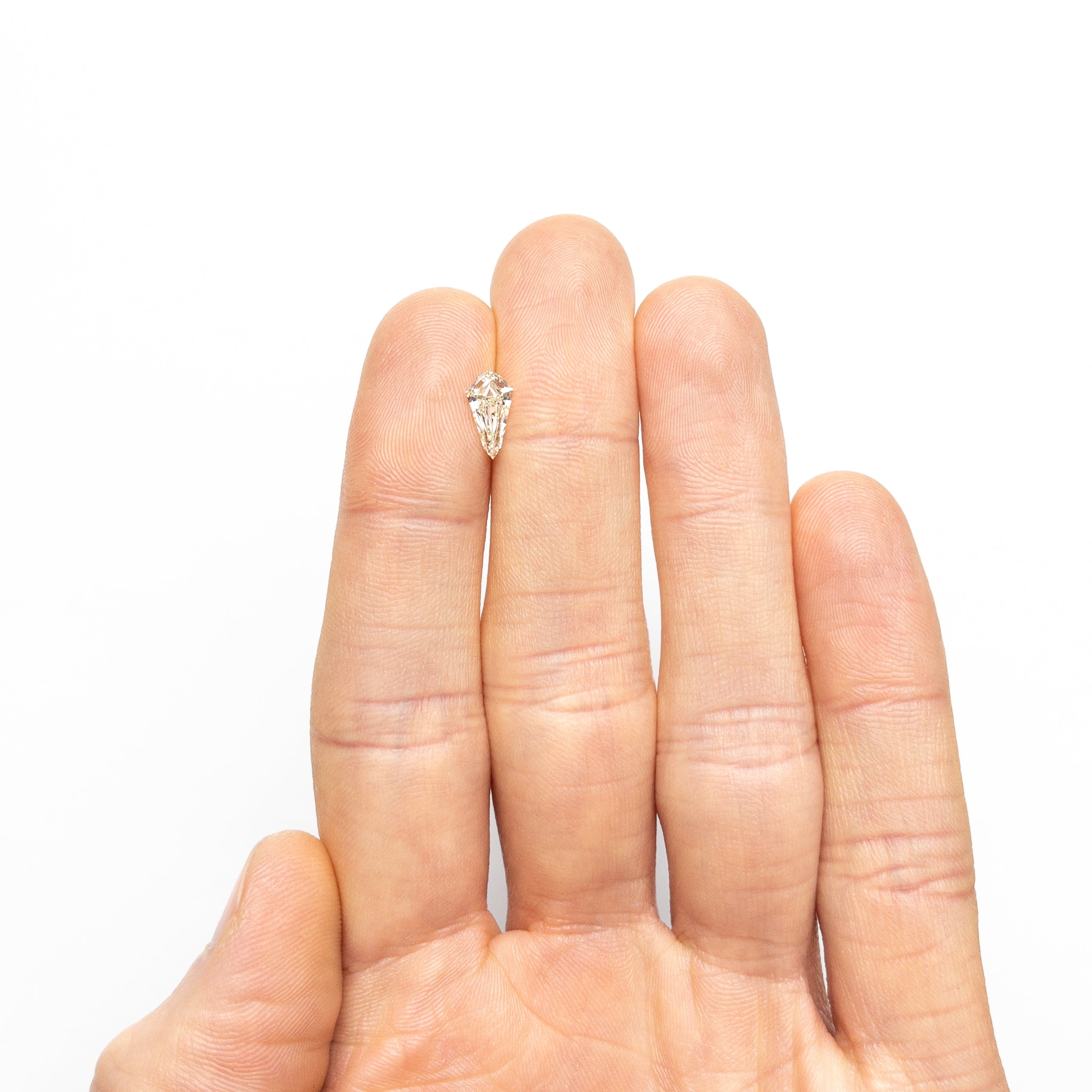 The 0.95ct 9.89x5.22x2.99mm SI1 L Shield Step Cut 25955-02 by East London jeweller Rachel Boston | Discover our collections of unique and timeless engagement rings, wedding rings, and modern fine jewellery.