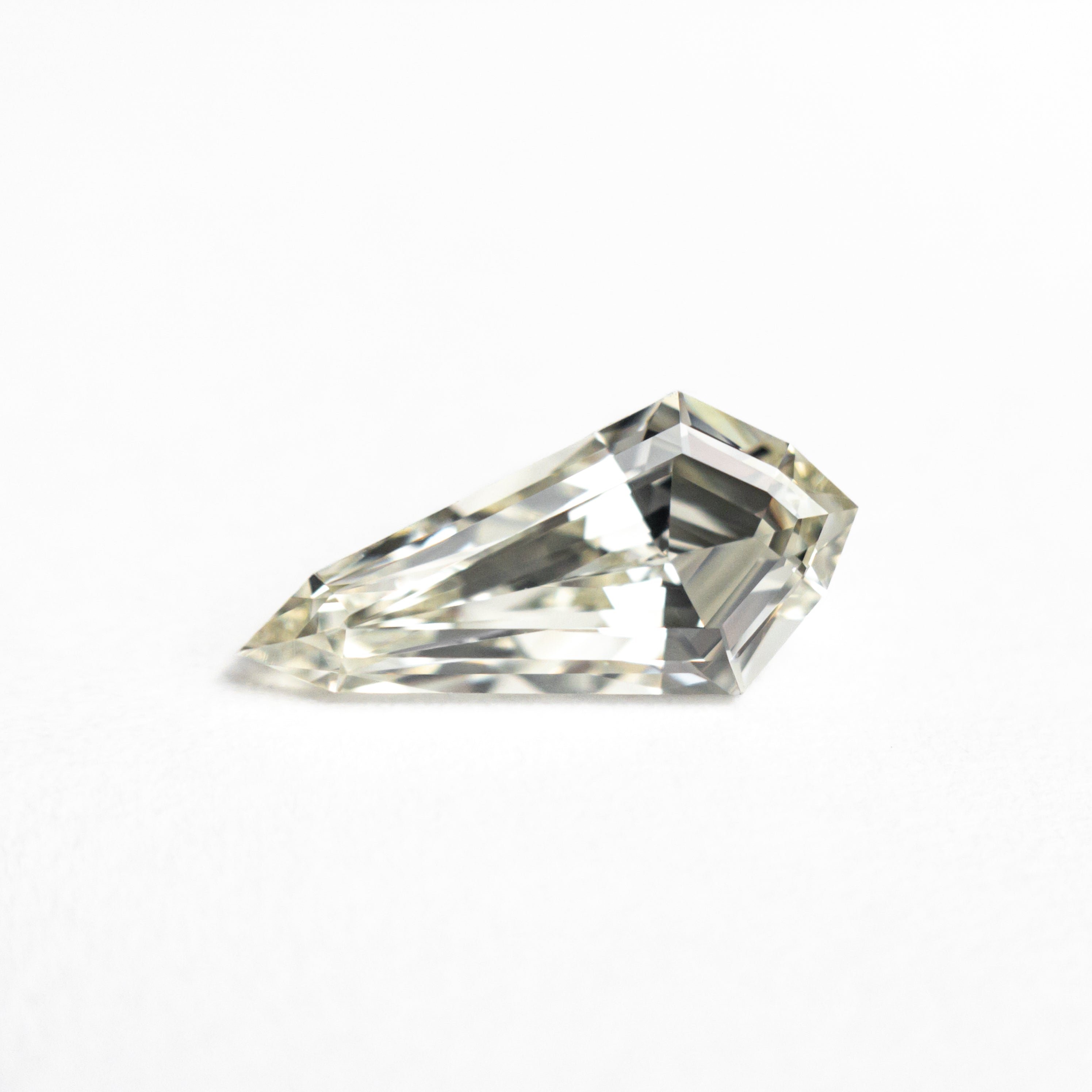 The 1.05ct 10.63x5.20x3.32mm VS1 M-N Shield Step Cut 25956-01 by East London jeweller Rachel Boston | Discover our collections of unique and timeless engagement rings, wedding rings, and modern fine jewellery.