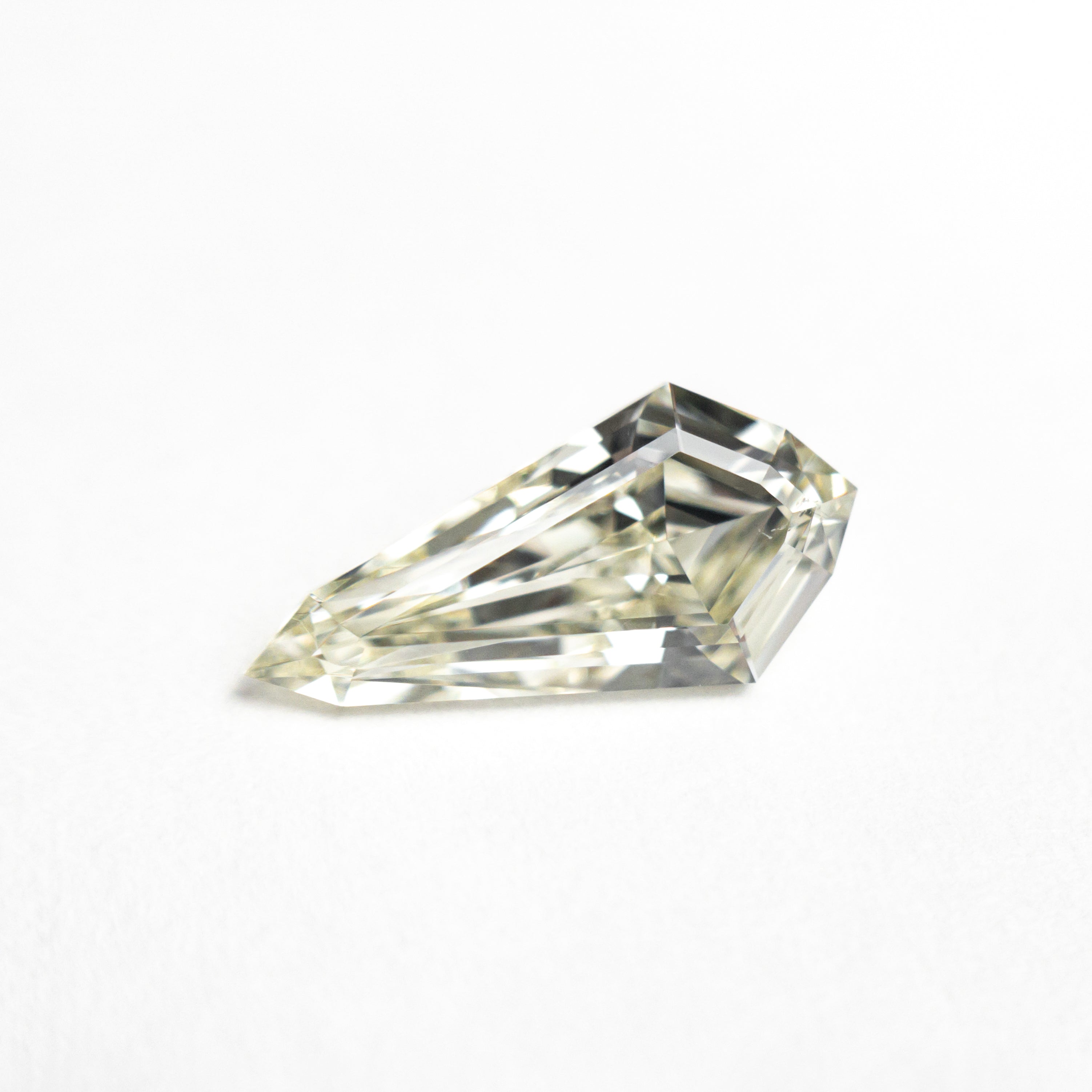 The 1.00ct 10.72x5.26x3.06mm SI1 M-N Shield Step Cut 25956-02 by East London jeweller Rachel Boston | Discover our collections of unique and timeless engagement rings, wedding rings, and modern fine jewellery.