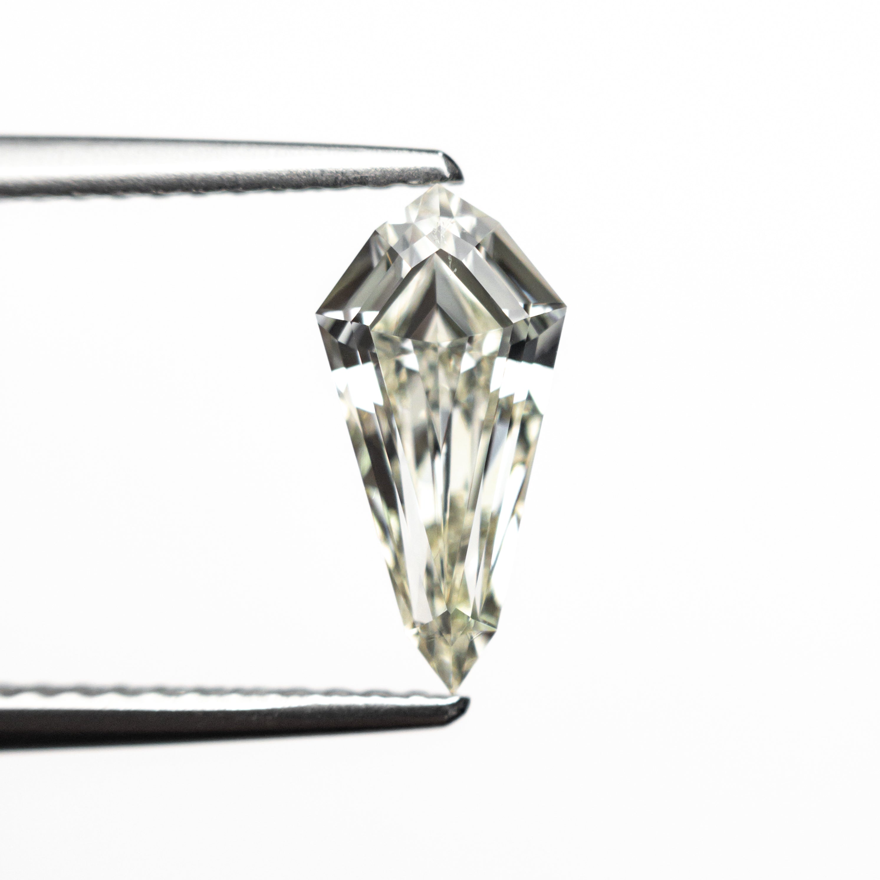 The 1.00ct 10.72x5.26x3.06mm SI1 M-N Shield Step Cut 25956-02 by East London jeweller Rachel Boston | Discover our collections of unique and timeless engagement rings, wedding rings, and modern fine jewellery.