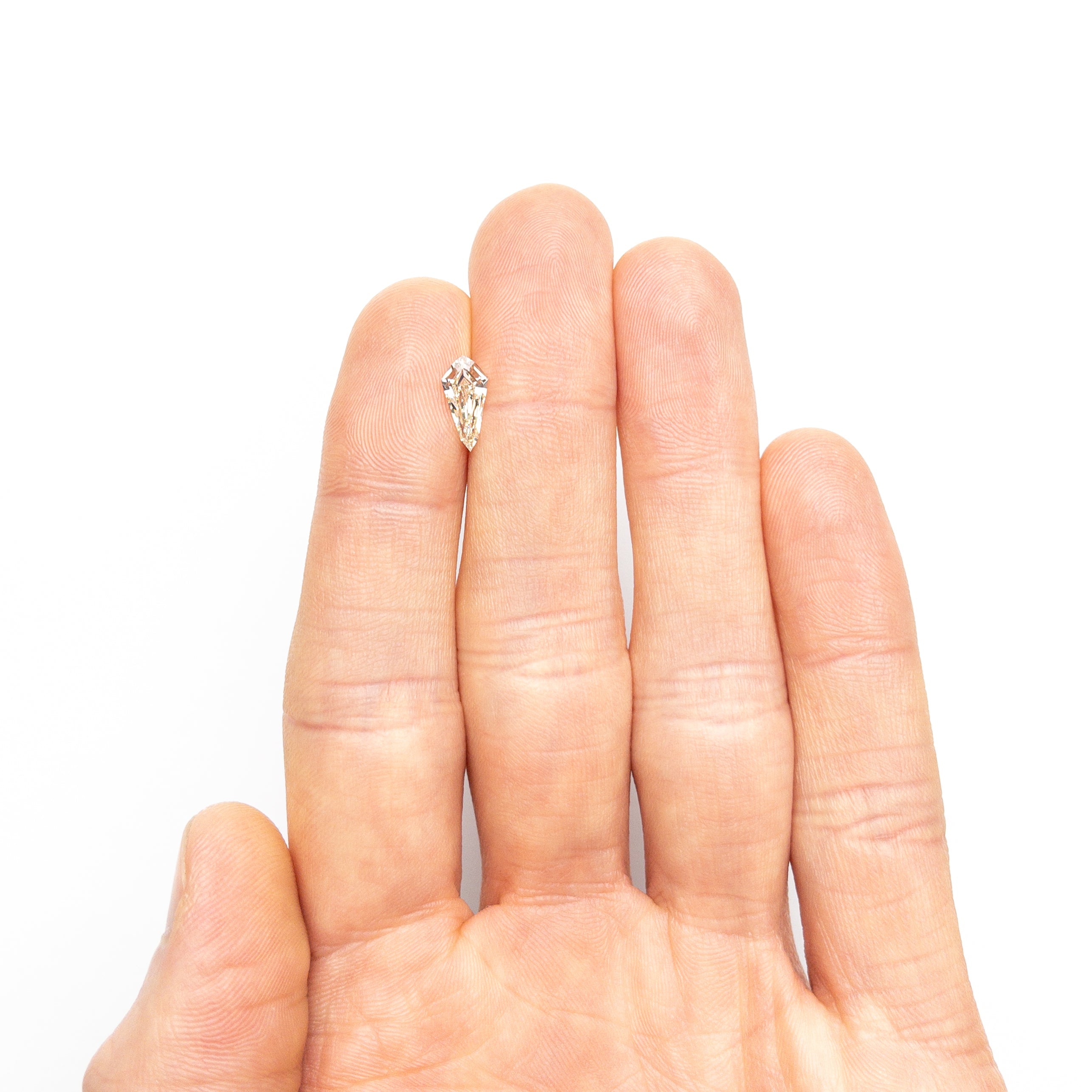 The 1.00ct 10.72x5.26x3.06mm SI1 M-N Shield Step Cut 25956-02 by East London jeweller Rachel Boston | Discover our collections of unique and timeless engagement rings, wedding rings, and modern fine jewellery.