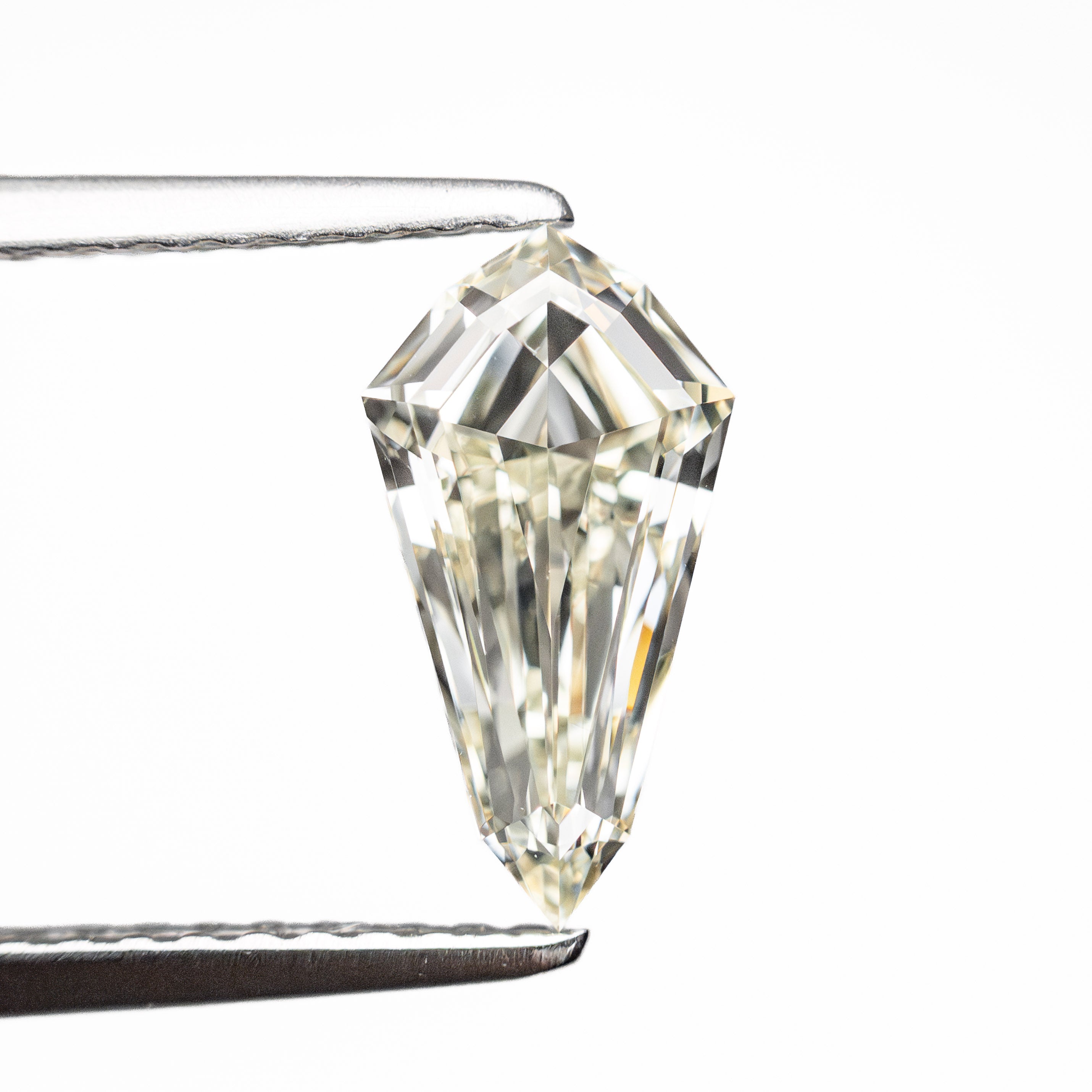 The 1.02ct 10.15x5.35x3.01mm VVS2 M-N Shield Step Cut 25957-01 by East London jeweller Rachel Boston | Discover our collections of unique and timeless engagement rings, wedding rings, and modern fine jewellery.