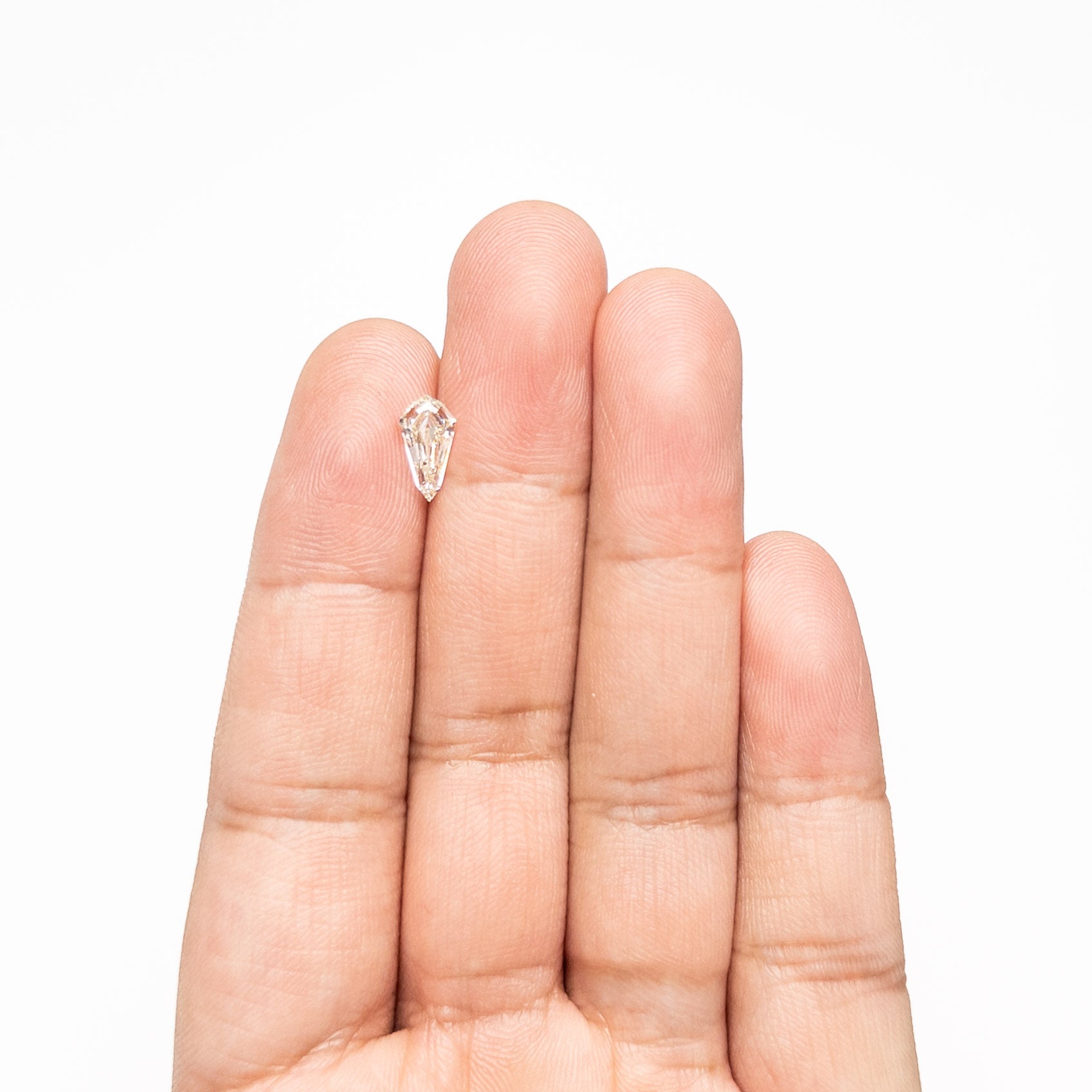 The 1.02ct 10.15x5.35x3.01mm VVS2 M-N Shield Step Cut 25957-01 by East London jeweller Rachel Boston | Discover our collections of unique and timeless engagement rings, wedding rings, and modern fine jewellery.