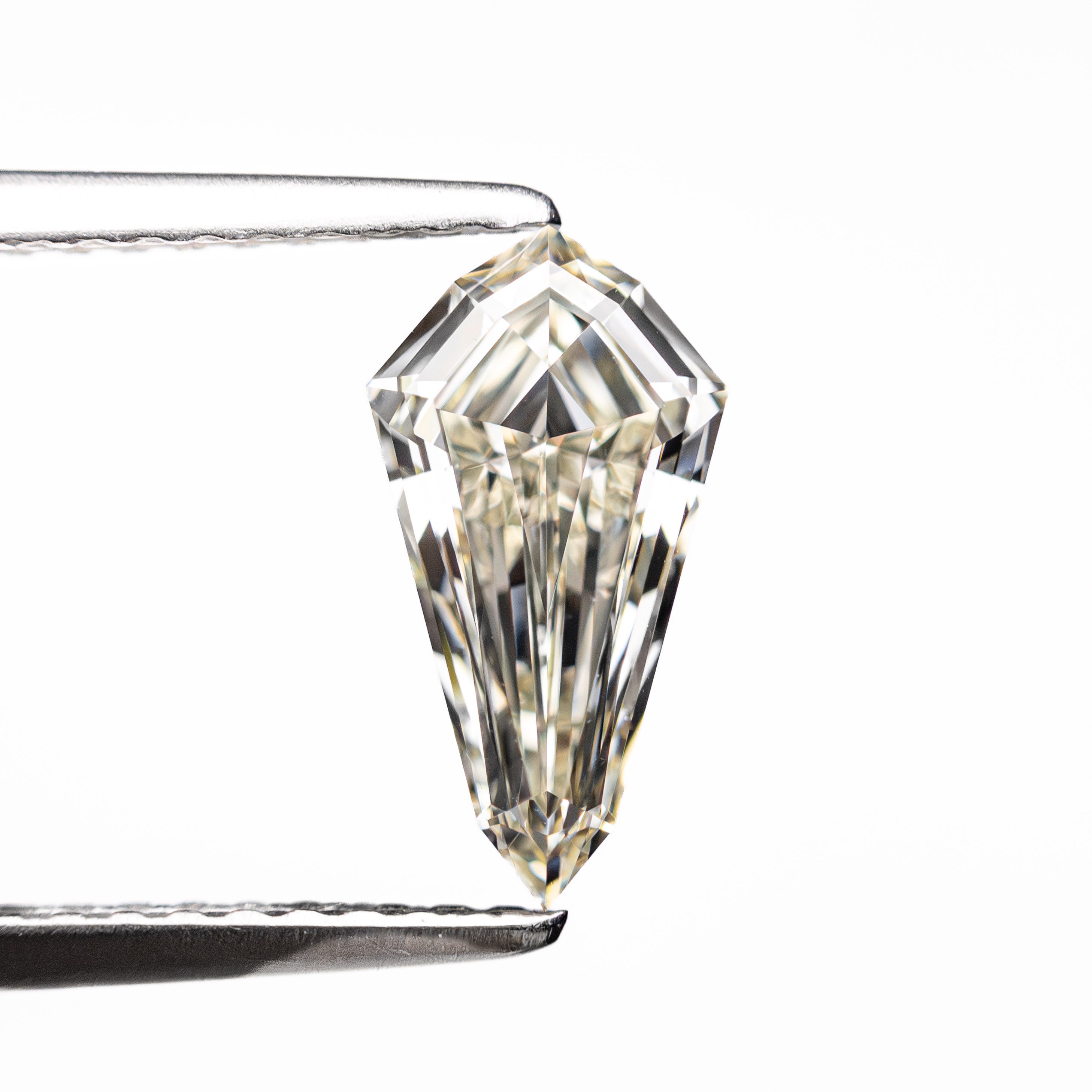The 1.00ct 10.15x5.36x3.05mm VVS1 L Shield Step Cut 25957-02 by East London jeweller Rachel Boston | Discover our collections of unique and timeless engagement rings, wedding rings, and modern fine jewellery.