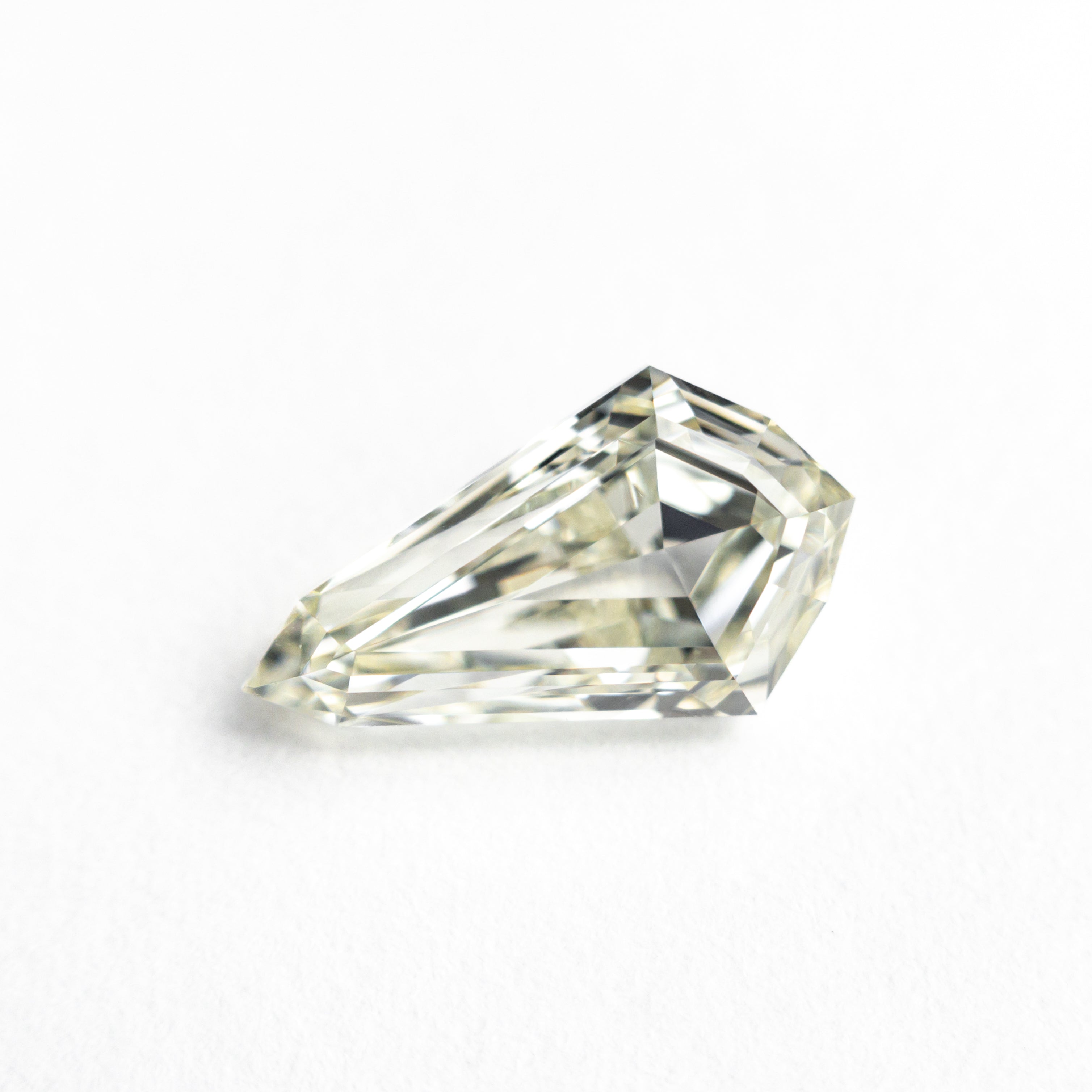 The 1.56ct 10.87x6.23x3.66mm VVS2 O-P Shield Step Cut 25958-01 by East London jeweller Rachel Boston | Discover our collections of unique and timeless engagement rings, wedding rings, and modern fine jewellery.