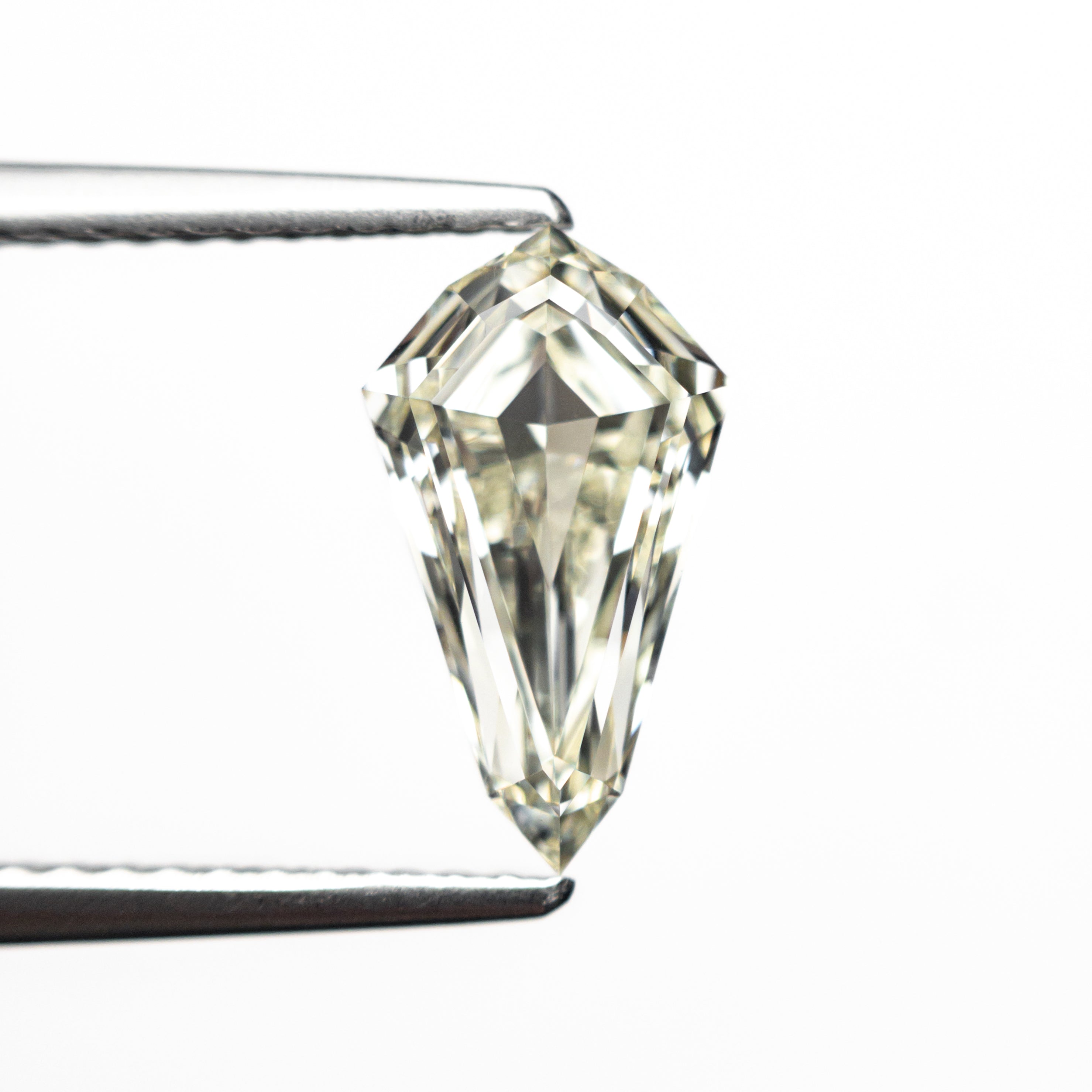 The 1.56ct 10.87x6.23x3.66mm VVS2 O-P Shield Step Cut 25958-01 by East London jeweller Rachel Boston | Discover our collections of unique and timeless engagement rings, wedding rings, and modern fine jewellery.