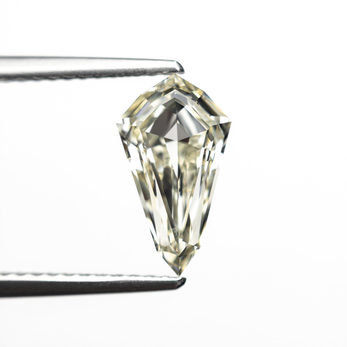 The 1.51ct 10.90x6.18x3.57mm VVS1 M-N Shield Step Cut 25958-02 by East London jeweller Rachel Boston | Discover our collections of unique and timeless engagement rings, wedding rings, and modern fine jewellery.