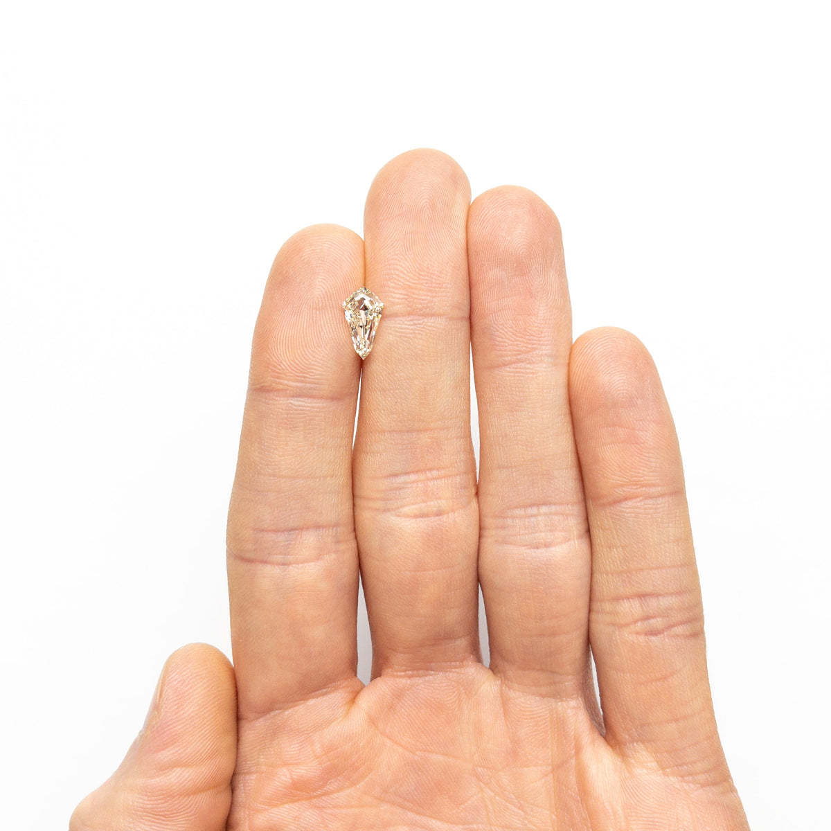 The 1.51ct 10.90x6.18x3.57mm VVS1 M-N Shield Step Cut 25958-02 by East London jeweller Rachel Boston | Discover our collections of unique and timeless engagement rings, wedding rings, and modern fine jewellery.