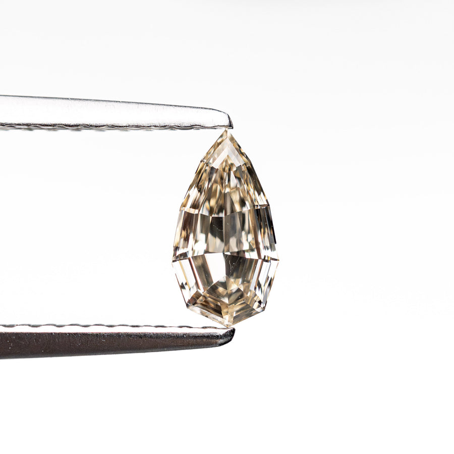 The 0.38ct 6.98x3.79x2.04mm VS1 C3 Geo Pear Step Cut 🇿🇦 26109-06 by East London jeweller Rachel Boston | Discover our collections of unique and timeless engagement rings, wedding rings, and modern fine jewellery. - Rachel Boston Jewellery