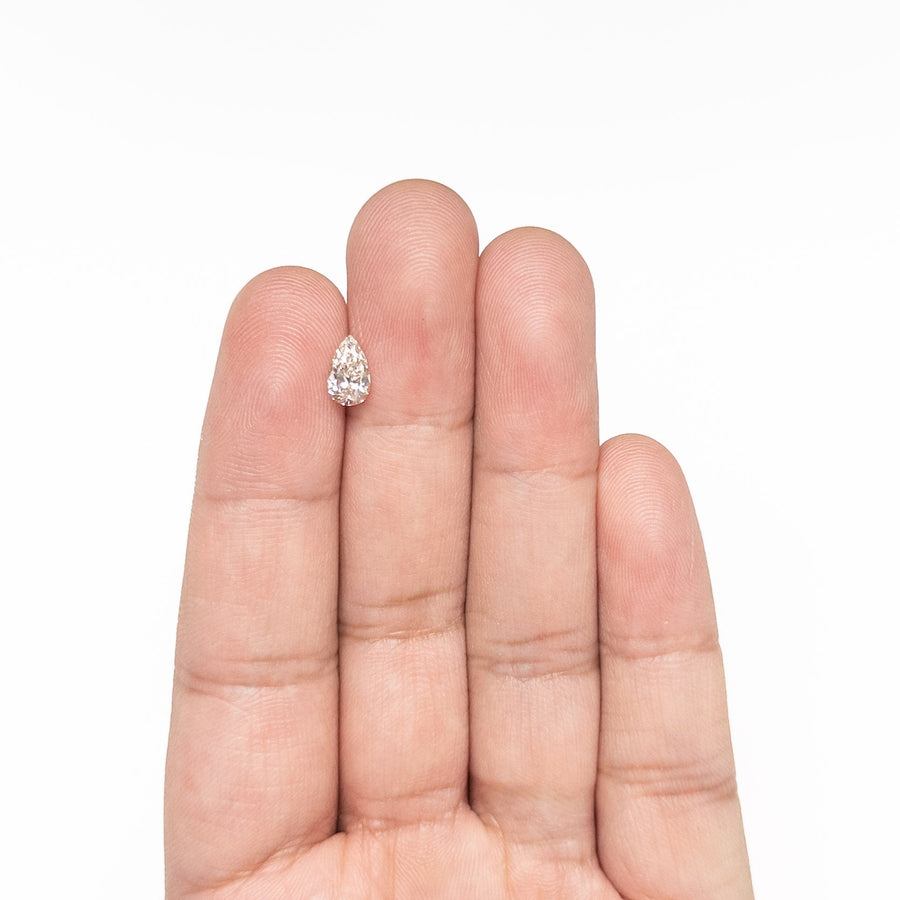The 0.70ct 7.94x4.75x3.02mm VVS2 U-V Pear Brilliant 🇨🇦 26121-04 by East London jeweller Rachel Boston | Discover our collections of unique and timeless engagement rings, wedding rings, and modern fine jewellery. - Rachel Boston Jewellery