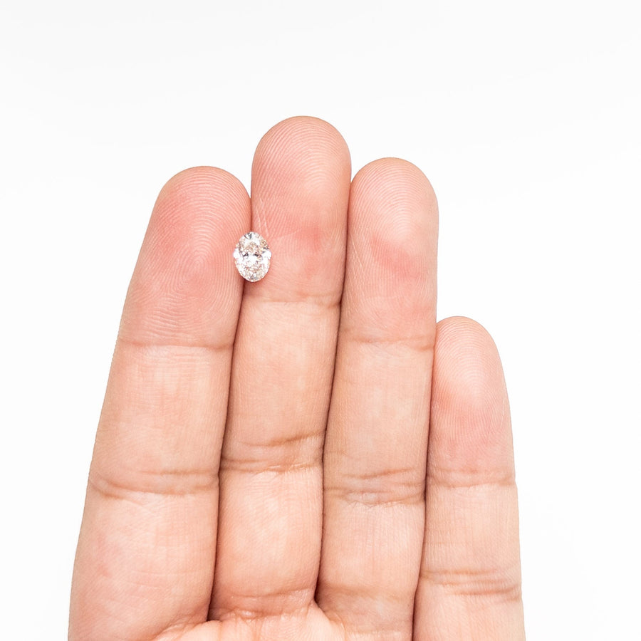 The 0.80ct 7.17x5.12x3.26mm SI1 J Oval Brilliant 🇨🇦 26121-09 by East London jeweller Rachel Boston | Discover our collections of unique and timeless engagement rings, wedding rings, and modern fine jewellery. - Rachel Boston Jewellery