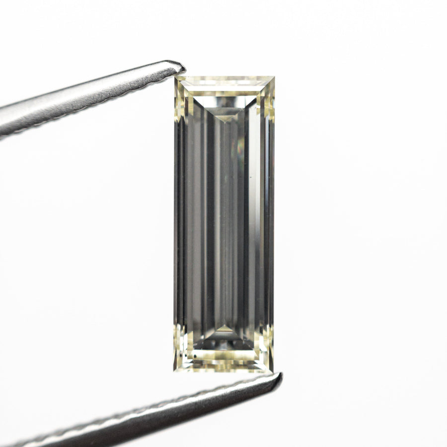The 1.52ct 12.21x4.16x2.86mm VS2 O-P Baguette Step Cut 26124-01 by East London jeweller Rachel Boston | Discover our collections of unique and timeless engagement rings, wedding rings, and modern fine jewellery. - Rachel Boston Jewellery