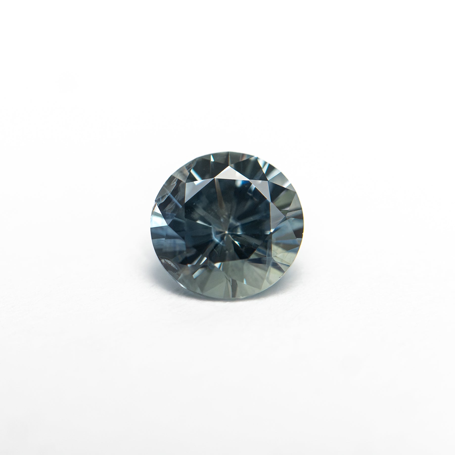 The 0.81ct 5.54x5.52x3.69mm Round Brilliant Sapphire 26134-04 by East London jeweller Rachel Boston | Discover our collections of unique and timeless engagement rings, wedding rings, and modern fine jewellery.