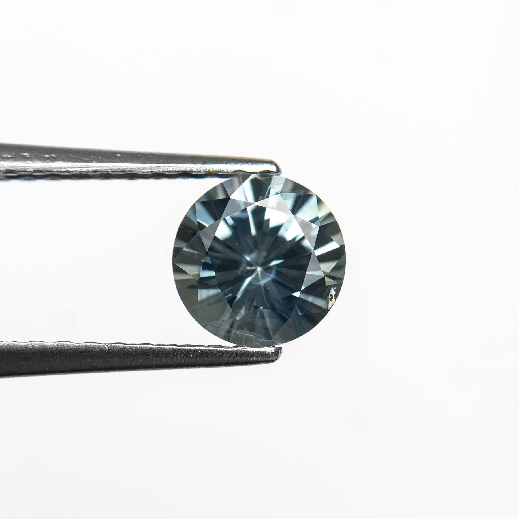 The 0.81ct 5.54x5.52x3.69mm Round Brilliant Sapphire 26134-04 by East London jeweller Rachel Boston | Discover our collections of unique and timeless engagement rings, wedding rings, and modern fine jewellery.