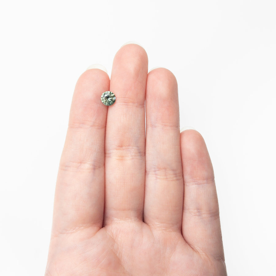 The 0.98ct 6.06x6.04x3.75mm Round Brilliant Sapphire 26141-22 by East London jeweller Rachel Boston | Discover our collections of unique and timeless engagement rings, wedding rings, and modern fine jewellery. - Rachel Boston Jewellery