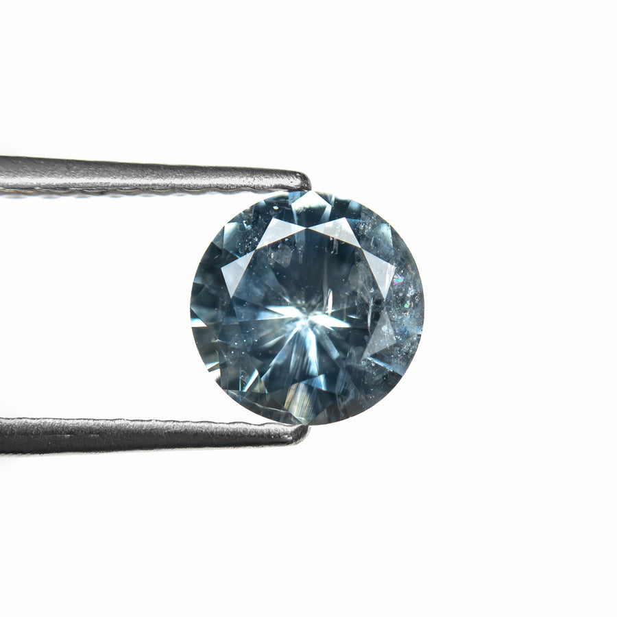 The 1.00ct 6.07x6.04x3.74mm Round Brilliant Sapphire 26141-23 by East London jeweller Rachel Boston | Discover our collections of unique and timeless engagement rings, wedding rings, and modern fine jewellery. - Rachel Boston Jewellery