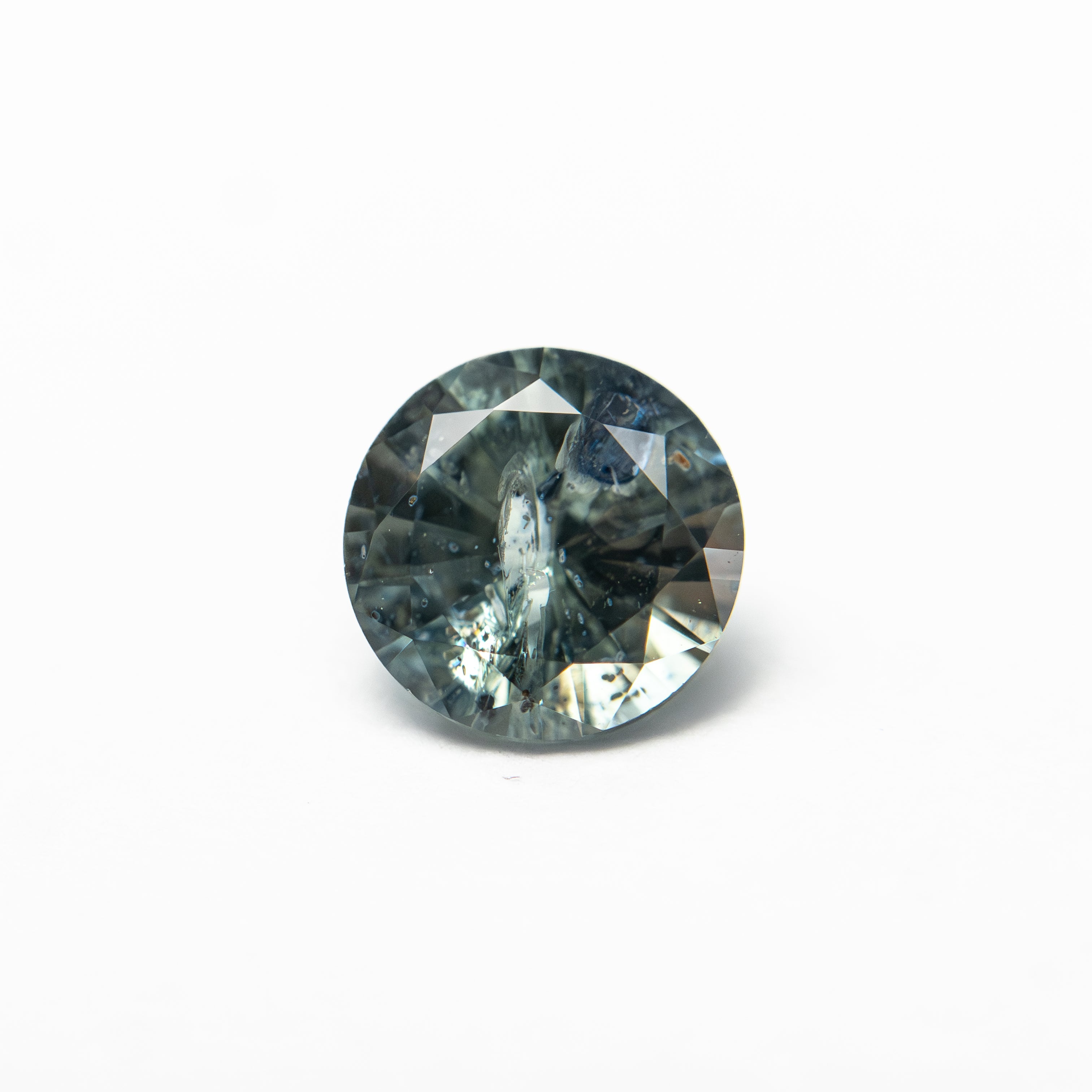 The 1.00ct 6.05x6.01x3.73mm Round Brilliant Sapphire 26141-28 by East London jeweller Rachel Boston | Discover our collections of unique and timeless engagement rings, wedding rings, and modern fine jewellery.