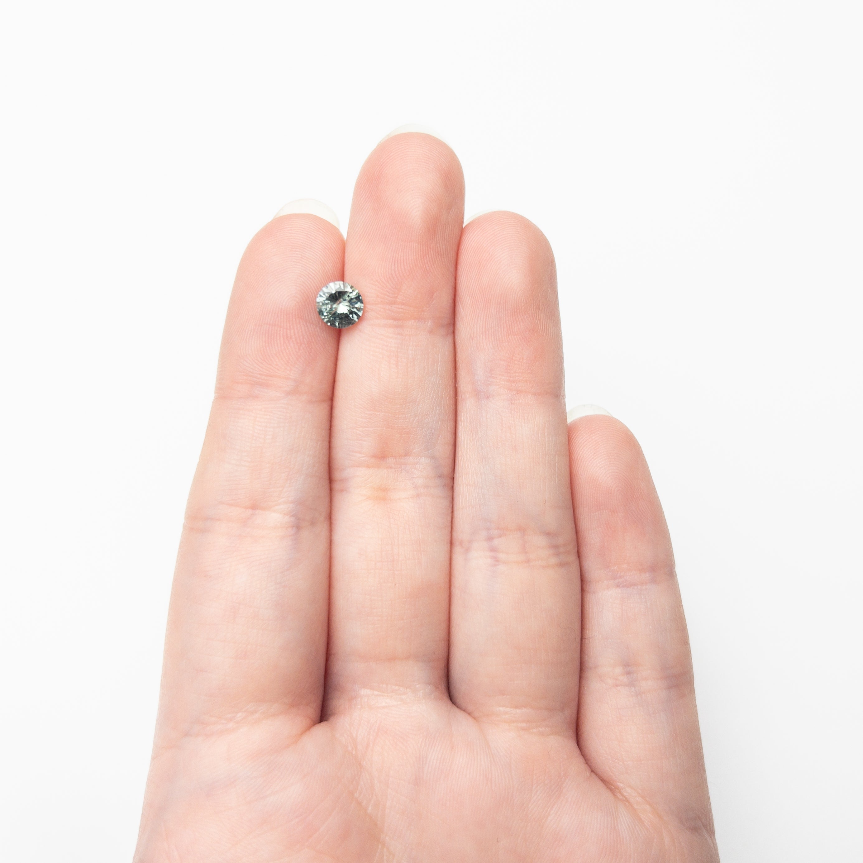 The 1.00ct 6.05x6.01x3.73mm Round Brilliant Sapphire 26141-28 by East London jeweller Rachel Boston | Discover our collections of unique and timeless engagement rings, wedding rings, and modern fine jewellery.
