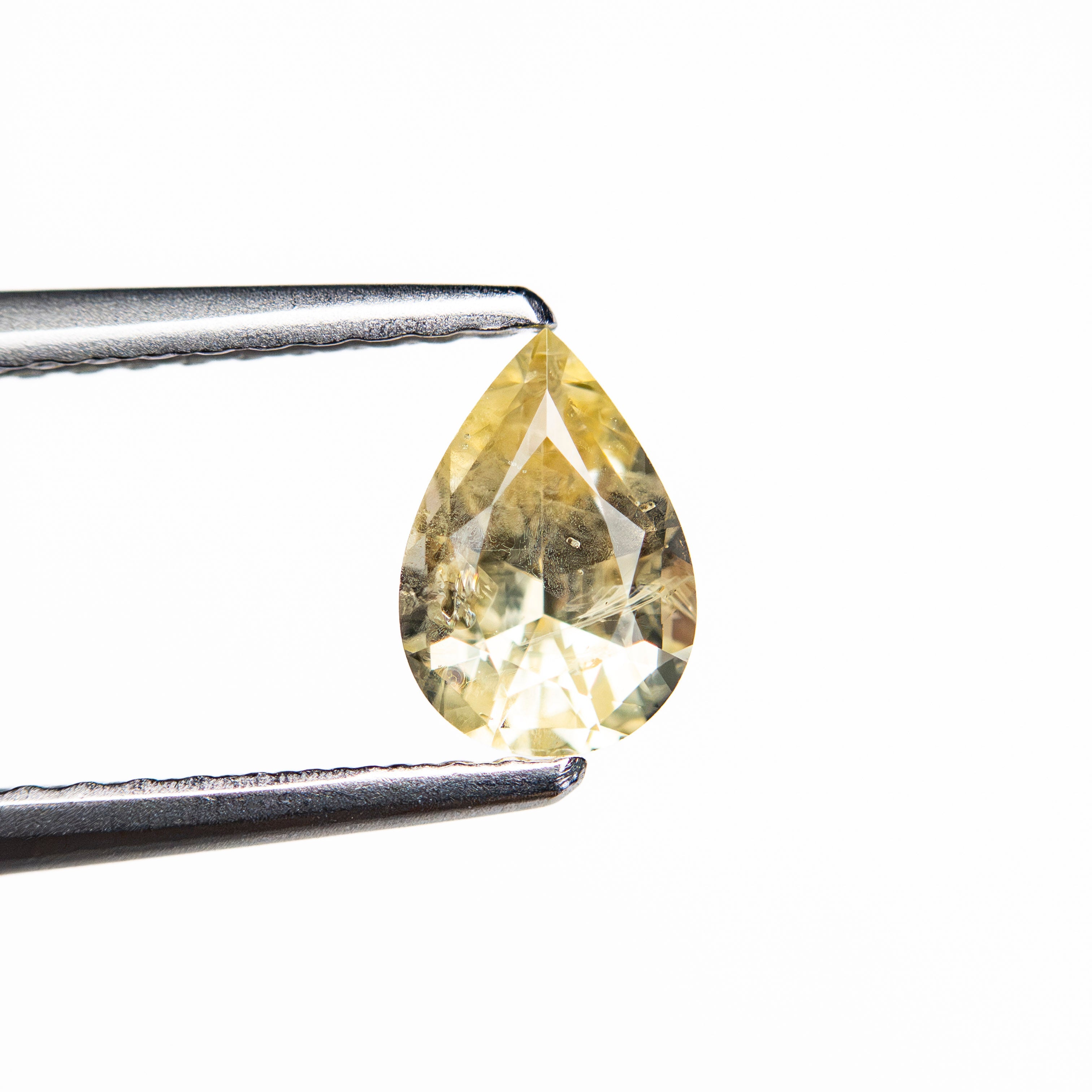 The 0.66ct 6.52x4.53x3.17mm Pear Brilliant Sapphire 26145-01 by East London jeweller Rachel Boston | Discover our collections of unique and timeless engagement rings, wedding rings, and modern fine jewellery.