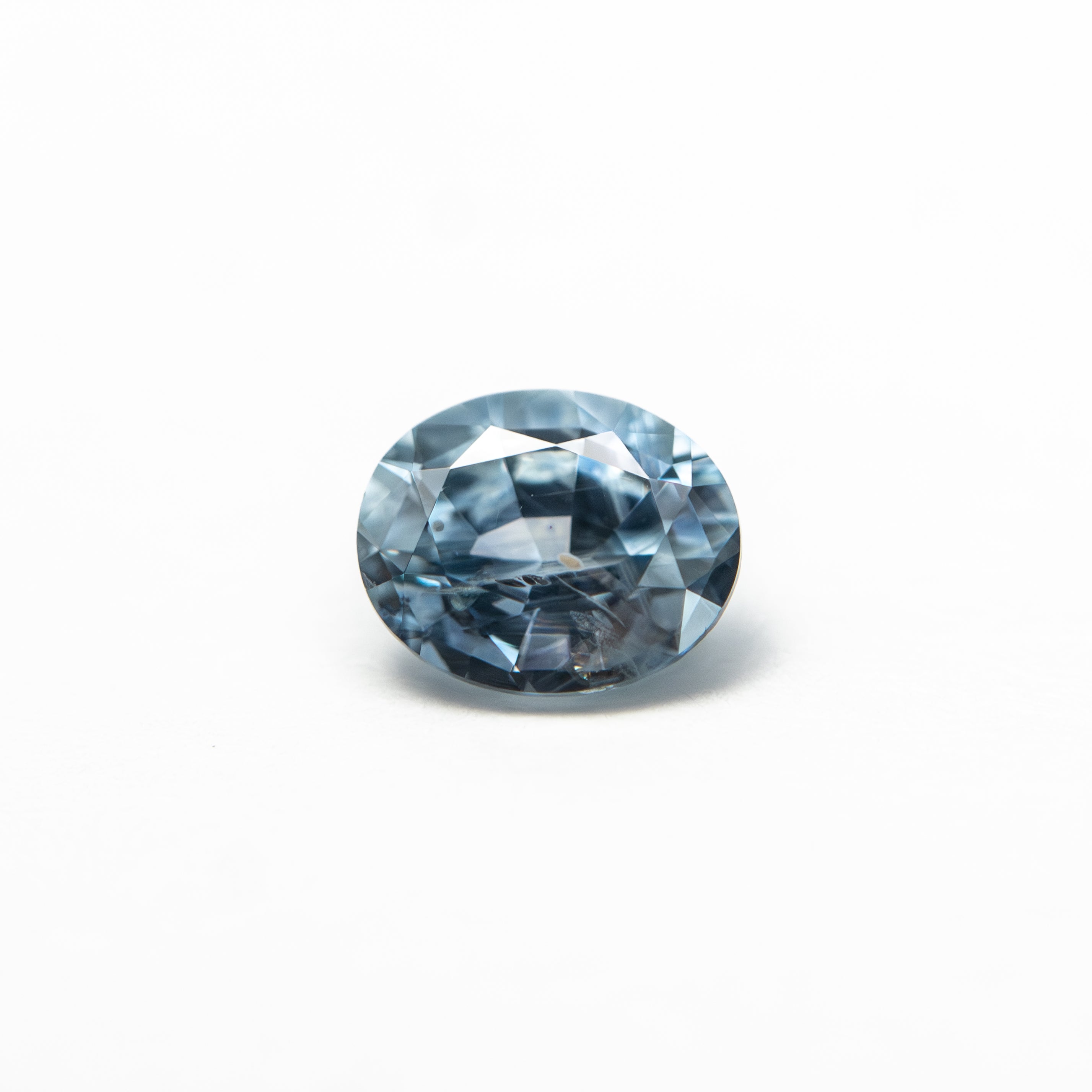 The 0.63ct 5.51x4.51x3.17mm Oval Brilliant Sapphire 26157-01 by East London jeweller Rachel Boston | Discover our collections of unique and timeless engagement rings, wedding rings, and modern fine jewellery.
