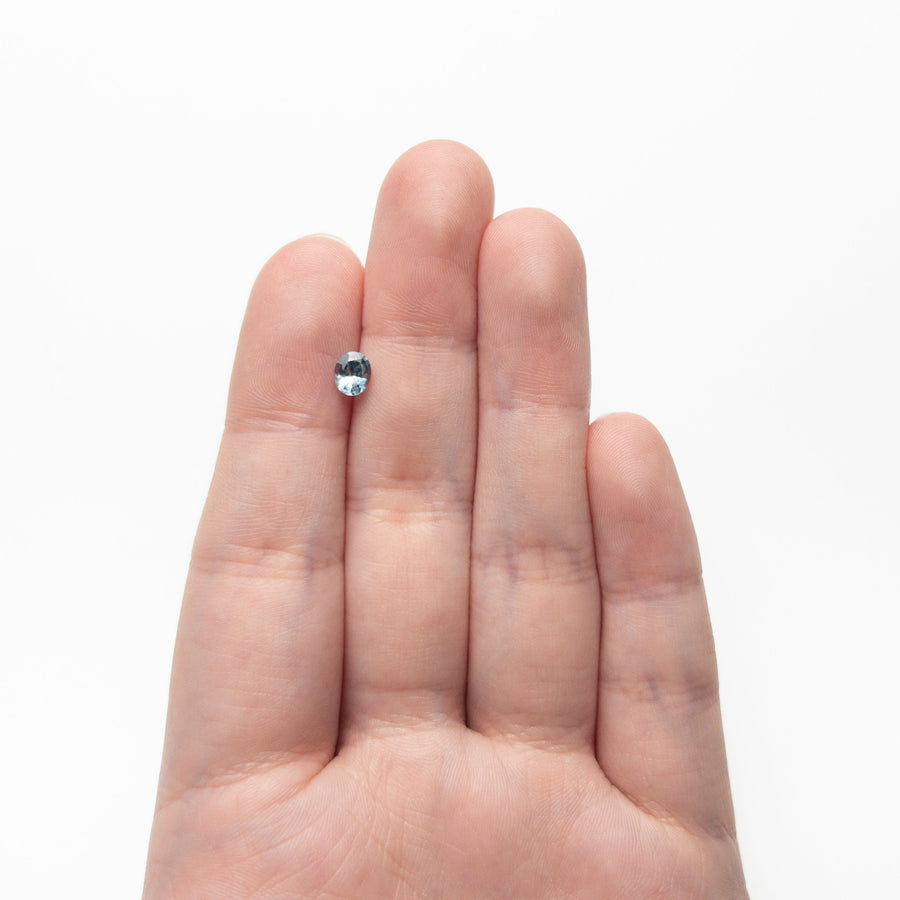 The 0.63ct 5.51x4.51x3.17mm Oval Brilliant Sapphire 26157-01 by East London jeweller Rachel Boston | Discover our collections of unique and timeless engagement rings, wedding rings, and modern fine jewellery. - Rachel Boston Jewellery