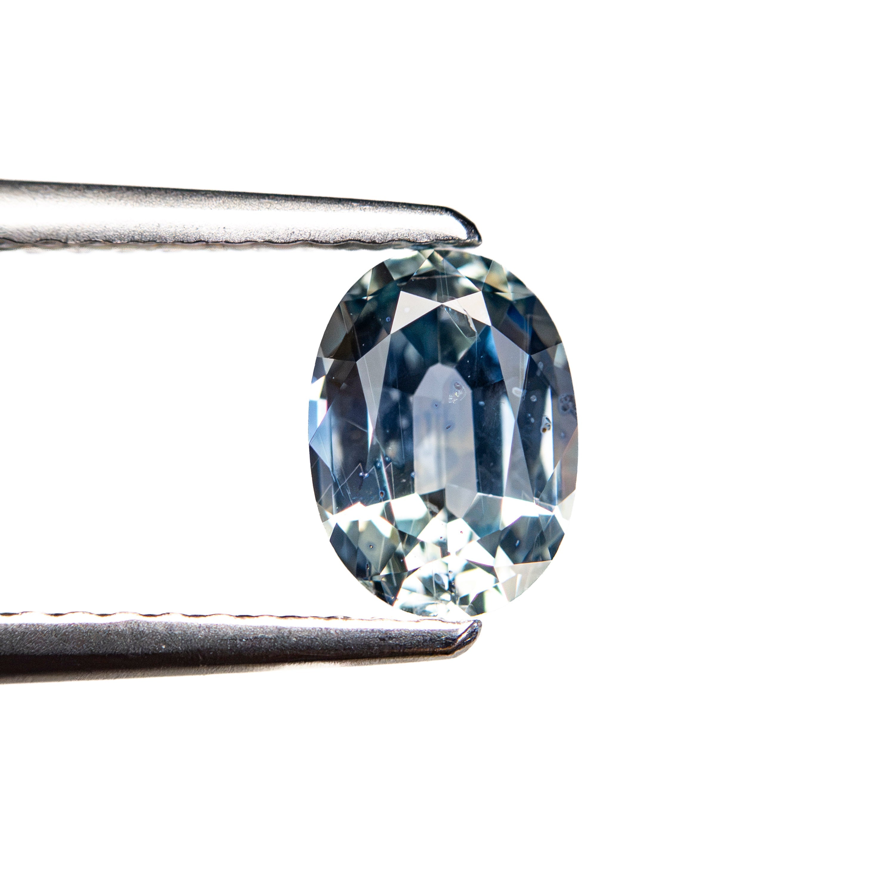The 0.98ct 6.91x5.02x3.20mm Oval Brilliant Sapphire 26162-05 by East London jeweller Rachel Boston | Discover our collections of unique and timeless engagement rings, wedding rings, and modern fine jewellery.