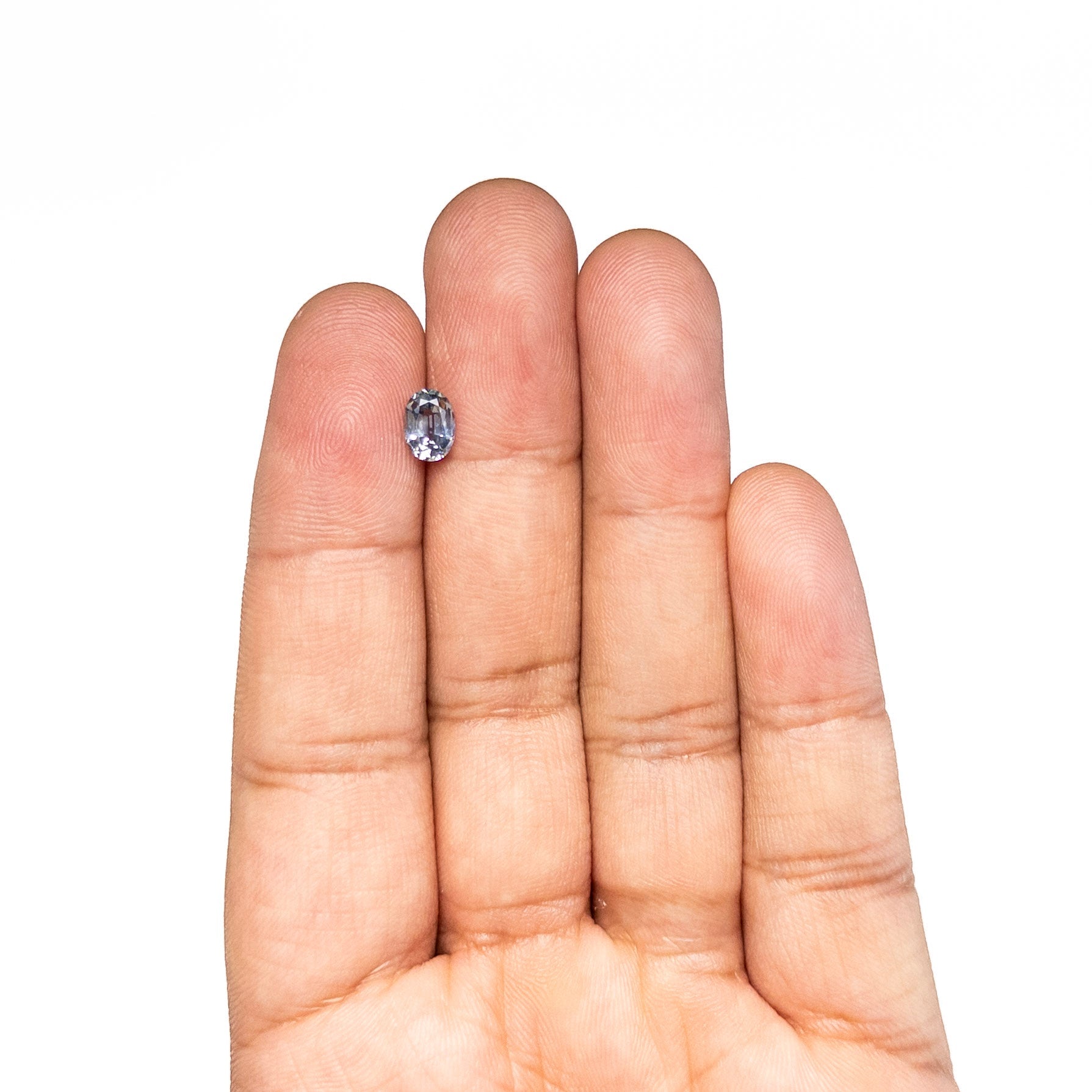 The 0.98ct 6.91x5.02x3.20mm Oval Brilliant Sapphire 26162-05 by East London jeweller Rachel Boston | Discover our collections of unique and timeless engagement rings, wedding rings, and modern fine jewellery.