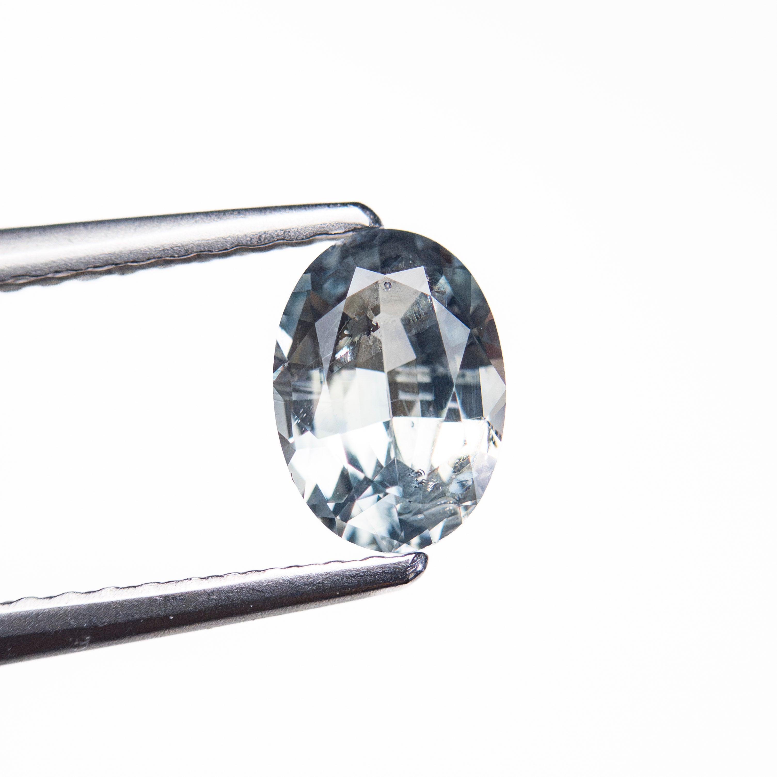 The 0.90ct 6.93x4.91x3.11mm Oval Brilliant Sapphire 26162-11 by East London jeweller Rachel Boston | Discover our collections of unique and timeless engagement rings, wedding rings, and modern fine jewellery.