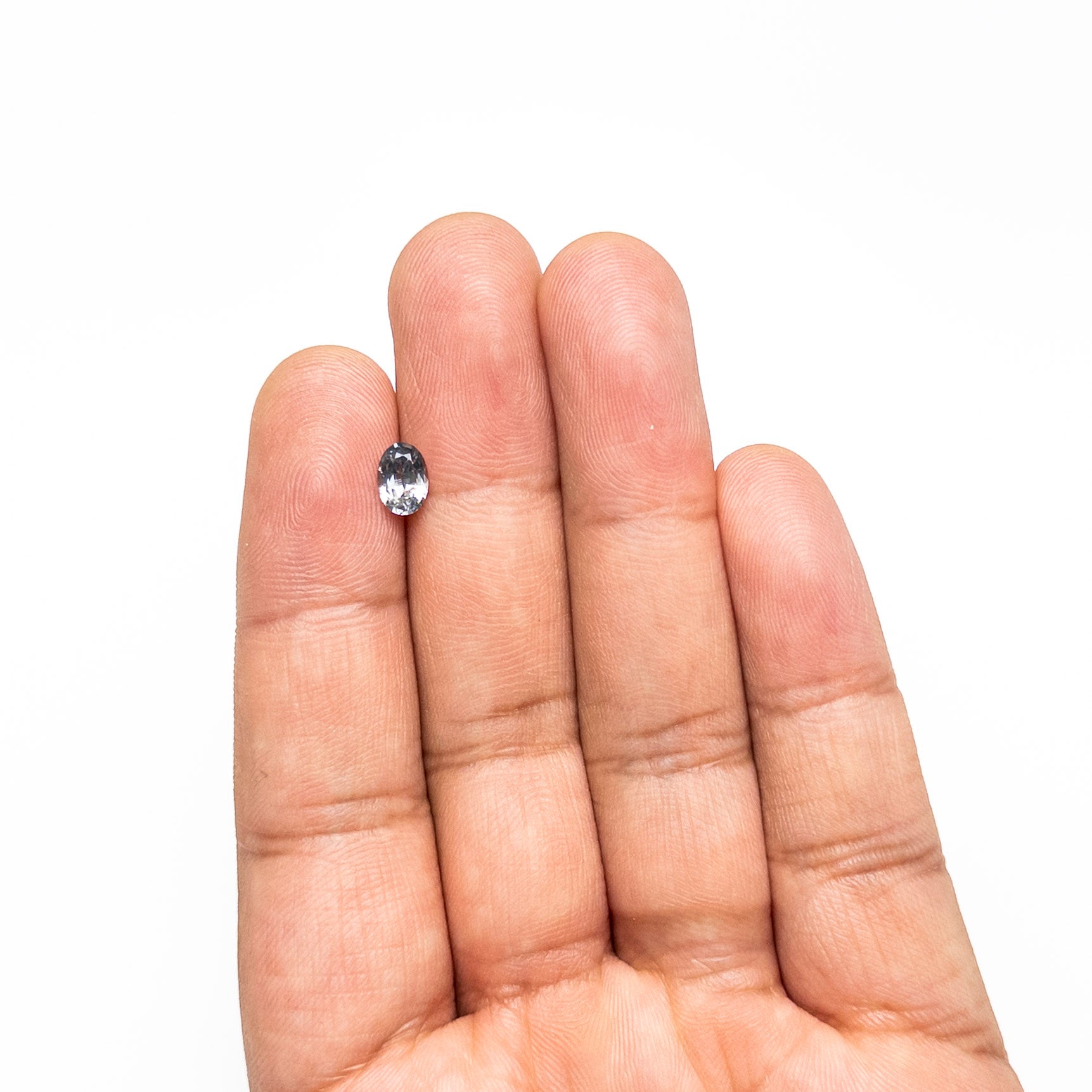 The 0.90ct 6.93x4.91x3.11mm Oval Brilliant Sapphire 26162-11 by East London jeweller Rachel Boston | Discover our collections of unique and timeless engagement rings, wedding rings, and modern fine jewellery.