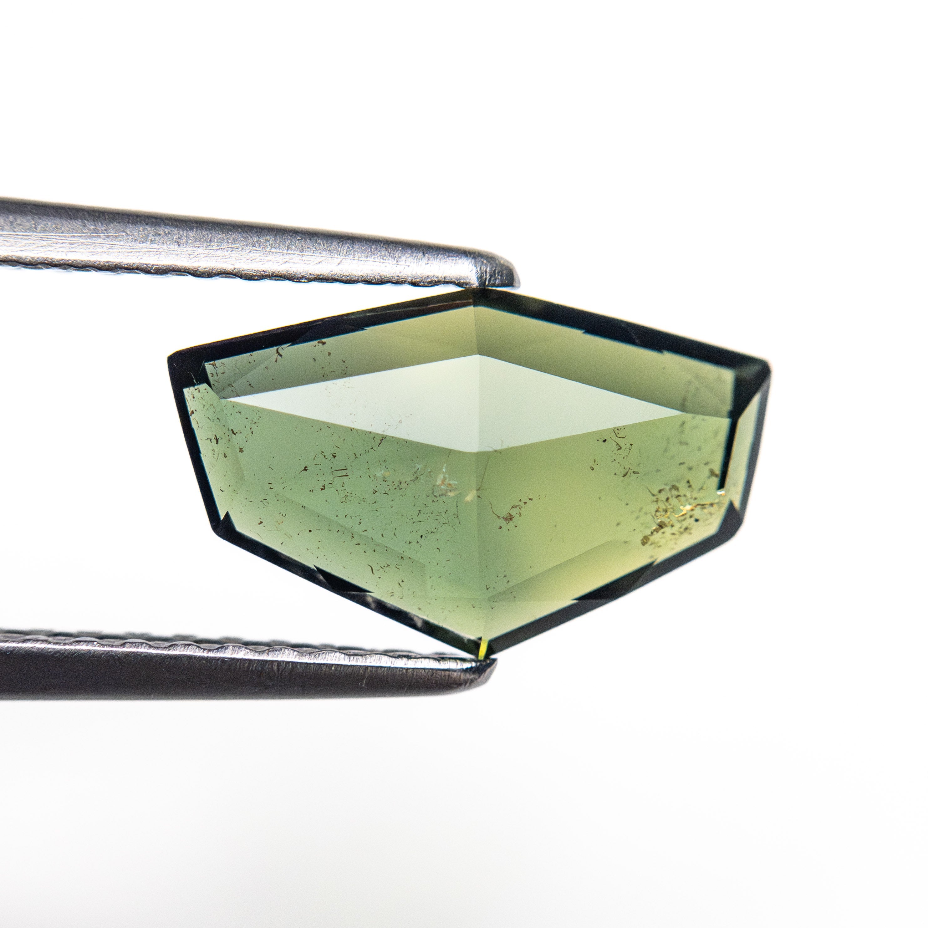 The 1.55ct 10.92x6.58x2.25mm Shield Rosecut Sapphire 26327-25 by East London jeweller Rachel Boston | Discover our collections of unique and timeless engagement rings, wedding rings, and modern fine jewellery.