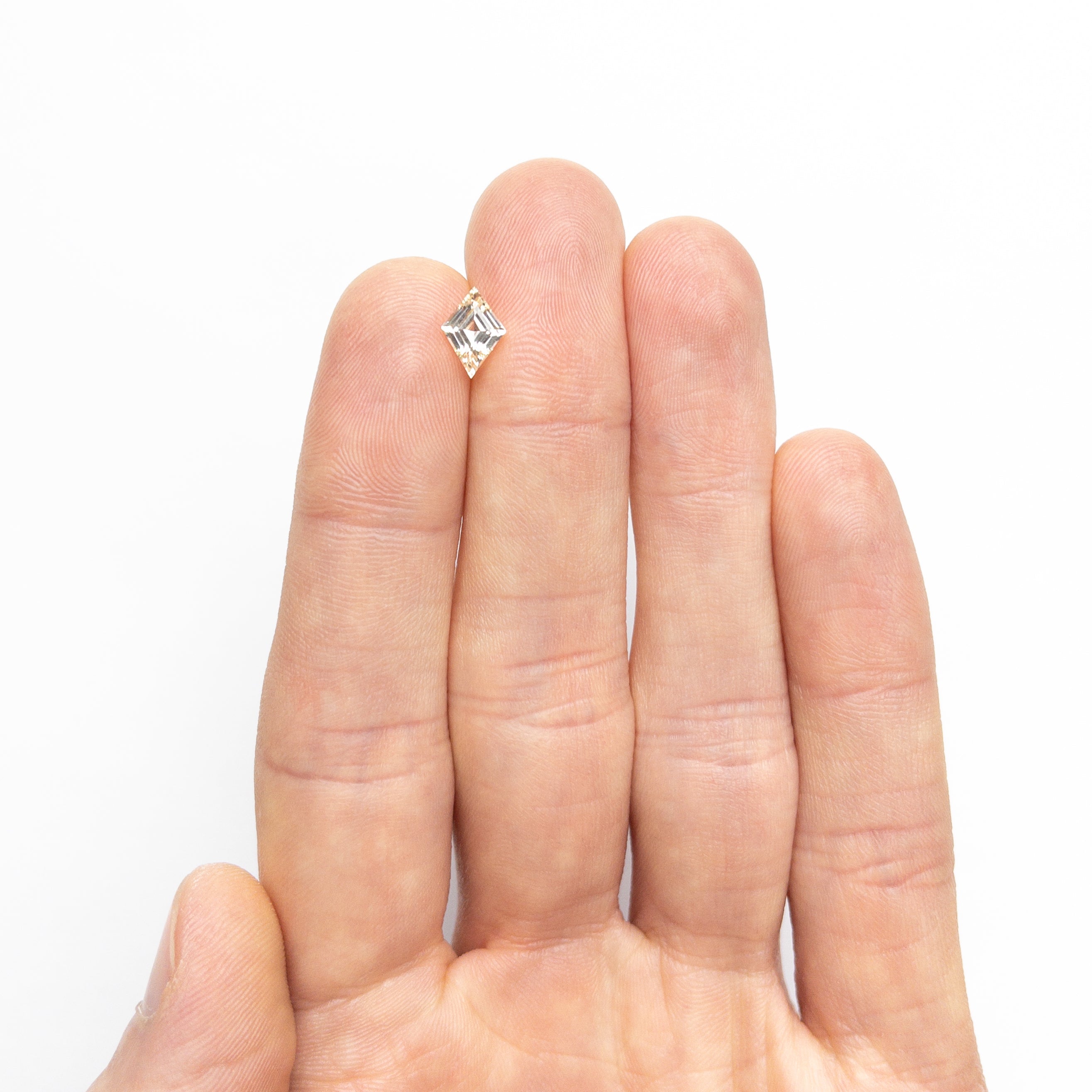 The 1.09ct 8.89x6.32x3.60mm Lozenge Step Cut Sapphire 26439-01 by East London jeweller Rachel Boston | Discover our collections of unique and timeless engagement rings, wedding rings, and modern fine jewellery.