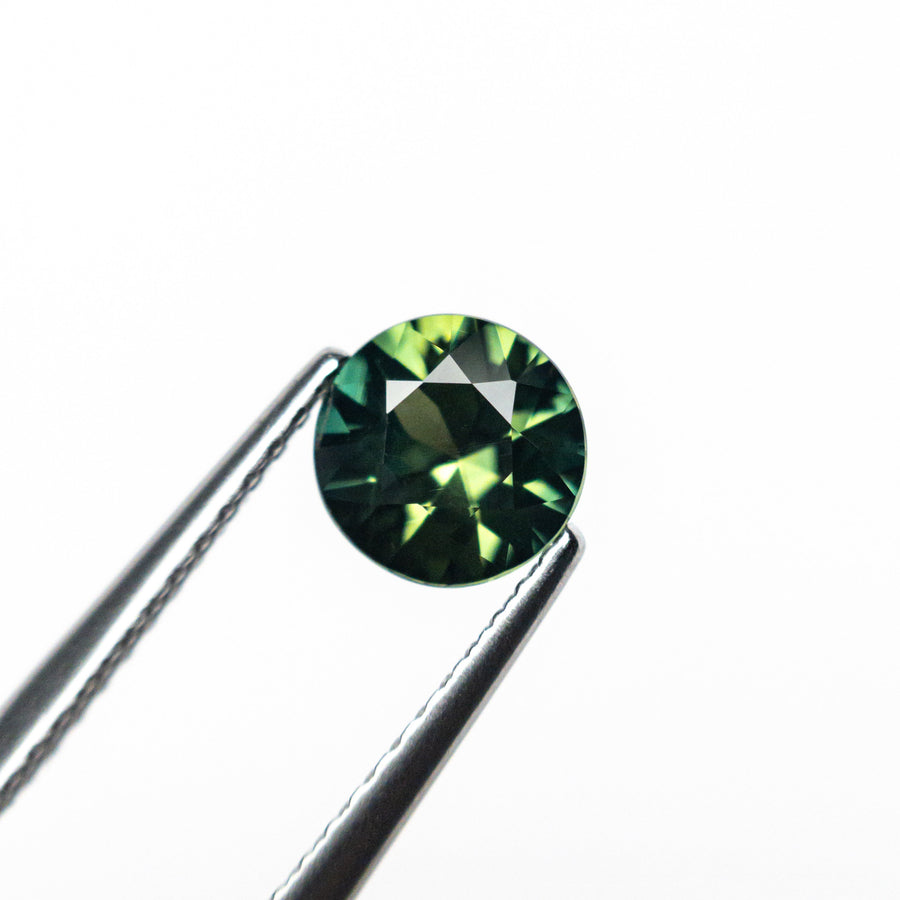 The 0.86ct 5.93x5.89x3.56mm Round Brilliant Sapphire 26492-01 by East London jeweller Rachel Boston | Discover our collections of unique and timeless engagement rings, wedding rings, and modern fine jewellery. - Rachel Boston Jewellery