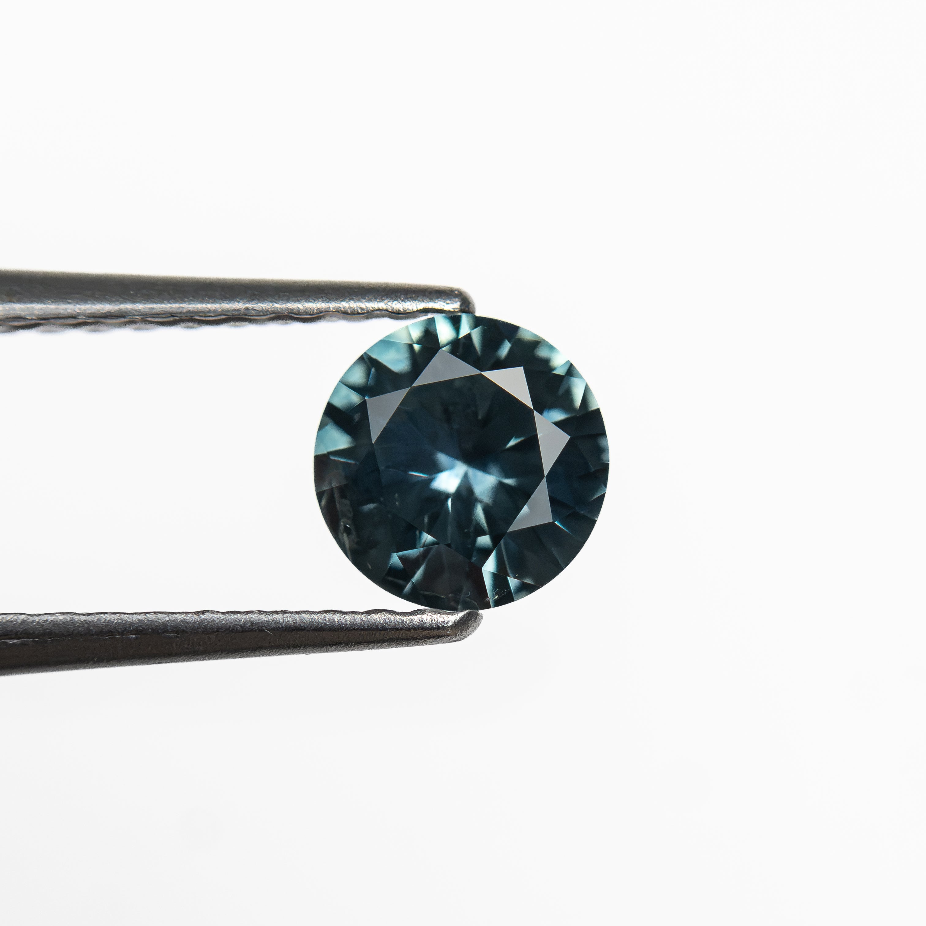 The 0.63ct 5.5.28x5.27x3.12mm Round Brilliant Sapphire 26526-10 by East London jeweller Rachel Boston | Discover our collections of unique and timeless engagement rings, wedding rings, and modern fine jewellery.