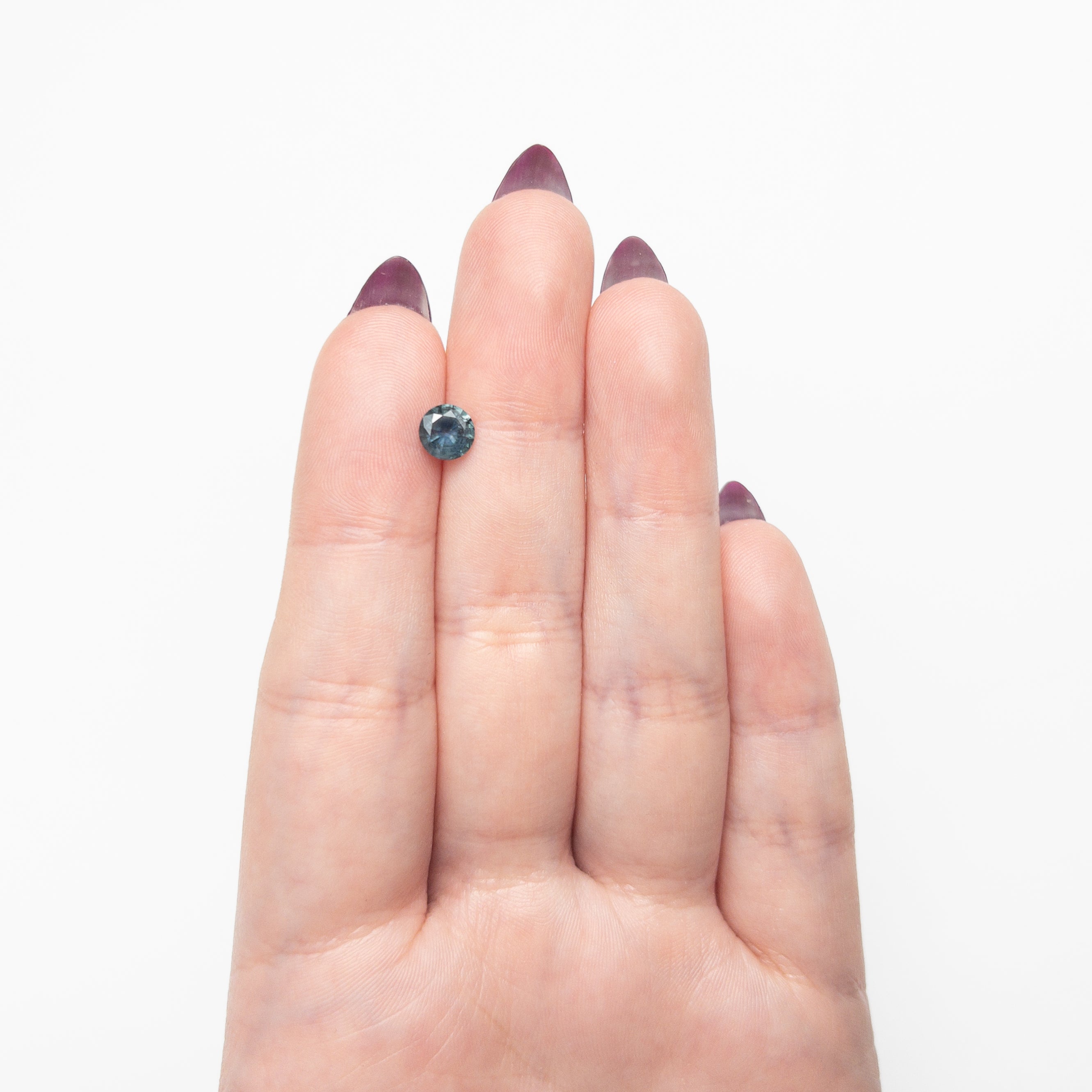The 0.93ct 6.00x5.98x3.65mm Round Brilliant Sapphire 26526-12 by East London jeweller Rachel Boston | Discover our collections of unique and timeless engagement rings, wedding rings, and modern fine jewellery.