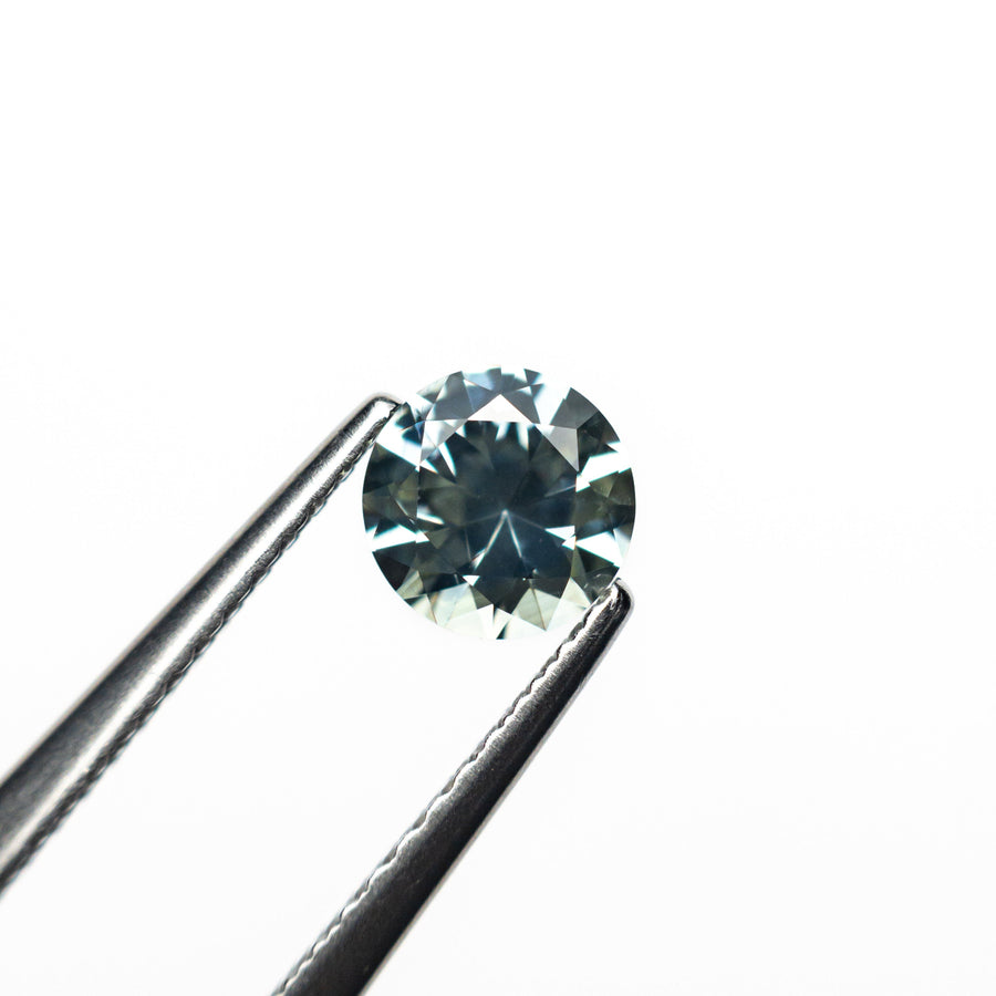 The 0.66ct 5.20x5.17x3.33mm Round Brilliant Sapphire 26556-12 by East London jeweller Rachel Boston | Discover our collections of unique and timeless engagement rings, wedding rings, and modern fine jewellery. - Rachel Boston Jewellery