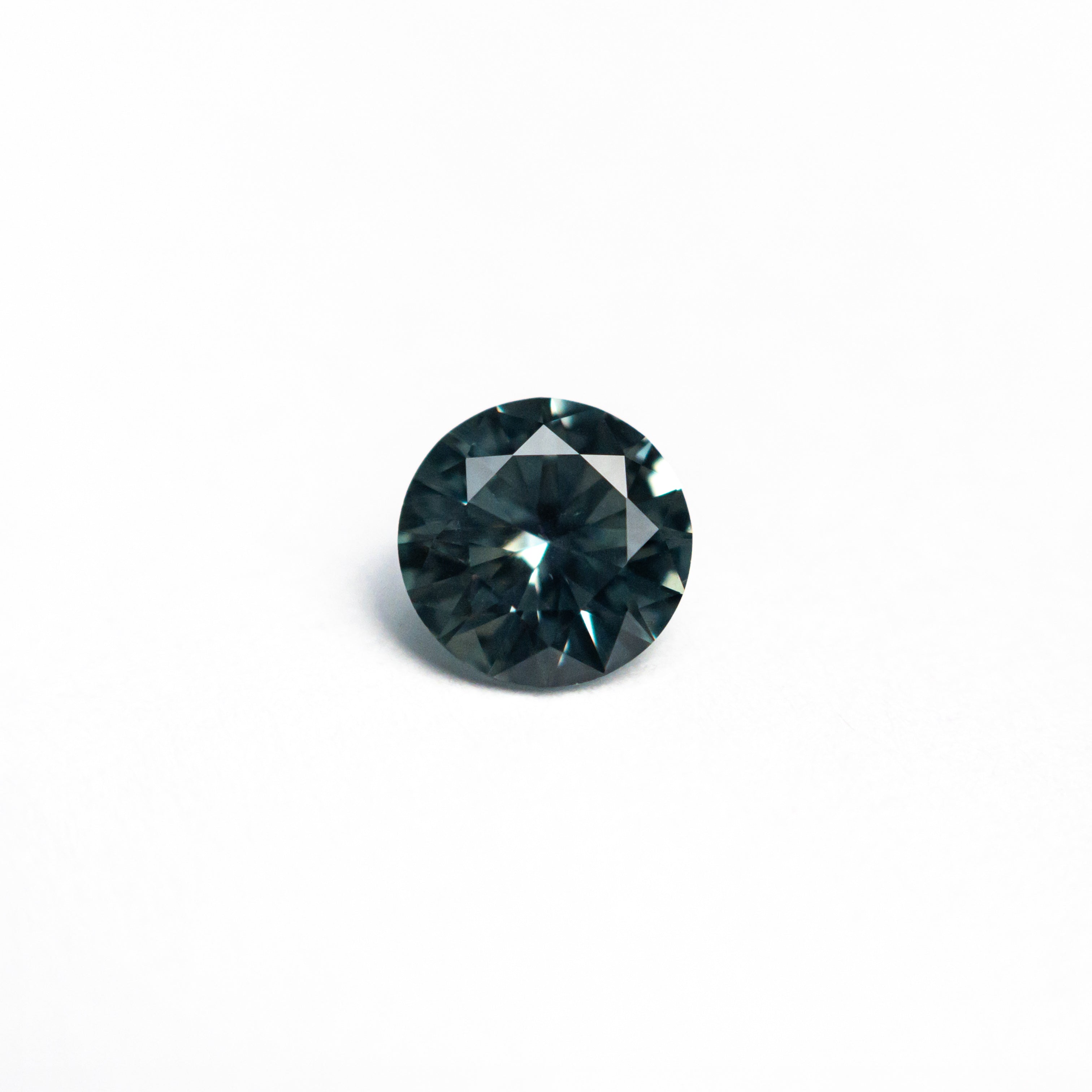 The 0.54ct 4.99x4.98x2.96mm Round Brilliant Sapphire 26556-13 by East London jeweller Rachel Boston | Discover our collections of unique and timeless engagement rings, wedding rings, and modern fine jewellery.