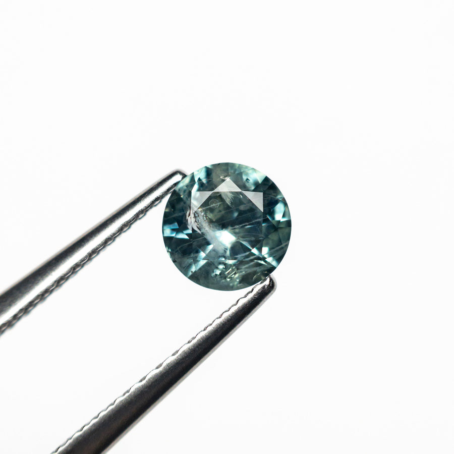 The 0.66ct 5.32x5.27x3.20mm Round Brilliant Sapphire 26556-18 by East London jeweller Rachel Boston | Discover our collections of unique and timeless engagement rings, wedding rings, and modern fine jewellery. - Rachel Boston Jewellery