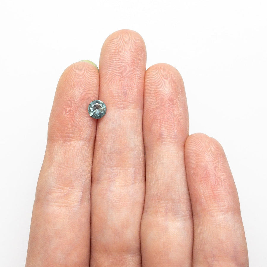 The 0.66ct 5.32x5.27x3.20mm Round Brilliant Sapphire 26556-18 by East London jeweller Rachel Boston | Discover our collections of unique and timeless engagement rings, wedding rings, and modern fine jewellery. - Rachel Boston Jewellery