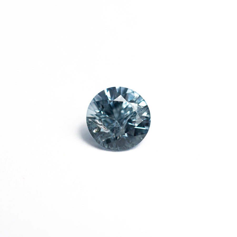 The 0.61ct 5.12x5.10x3.37mm Round Brilliant Sapphire 26556-20 by East London jeweller Rachel Boston | Discover our collections of unique and timeless engagement rings, wedding rings, and modern fine jewellery. - Rachel Boston Jewellery